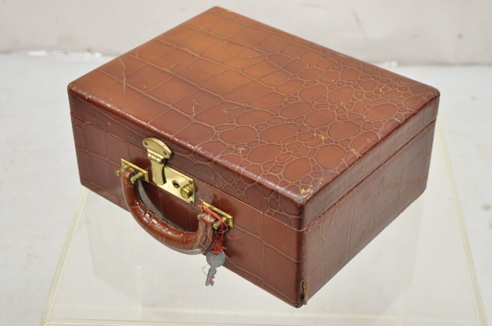 Vintage Brown Leather Art Deco Crocodile Embossed Small Toiletry Travel Vanity Case. Item features has a working lock and key, original label, very nice vintage case. Early 1900s. Measurements: 5