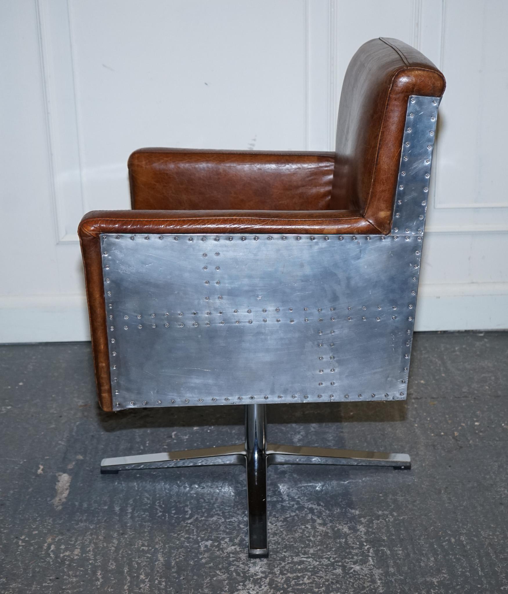 
Antiques of London



We are delighted to offer for sale this Vintage Brown Leather Aviator Metal Swivel Office Captain's Armchair.

 This exudes a classic charm with its distinctive design, combining luxurious leather upholstery with a robust
