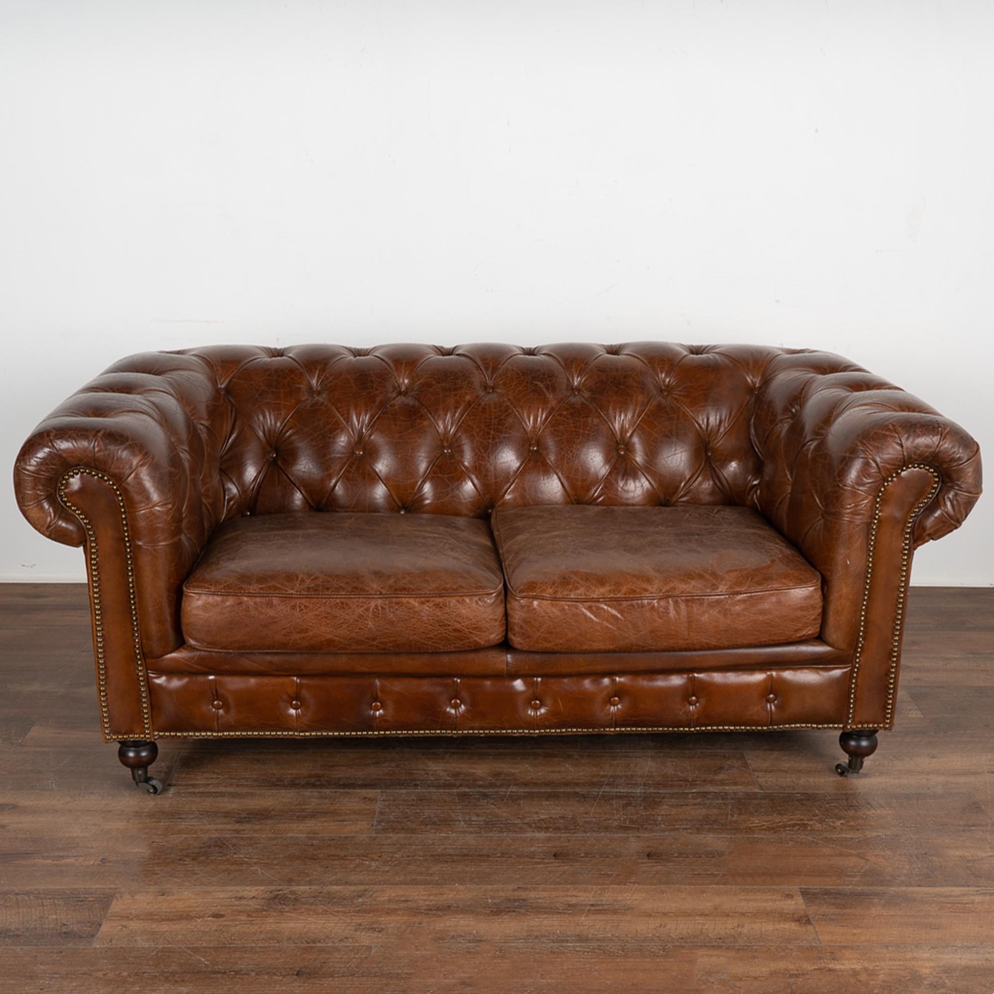 English Vintage Brown Leather Chesterfield Two Seat Sofa Loveseat, England circa 1960-80