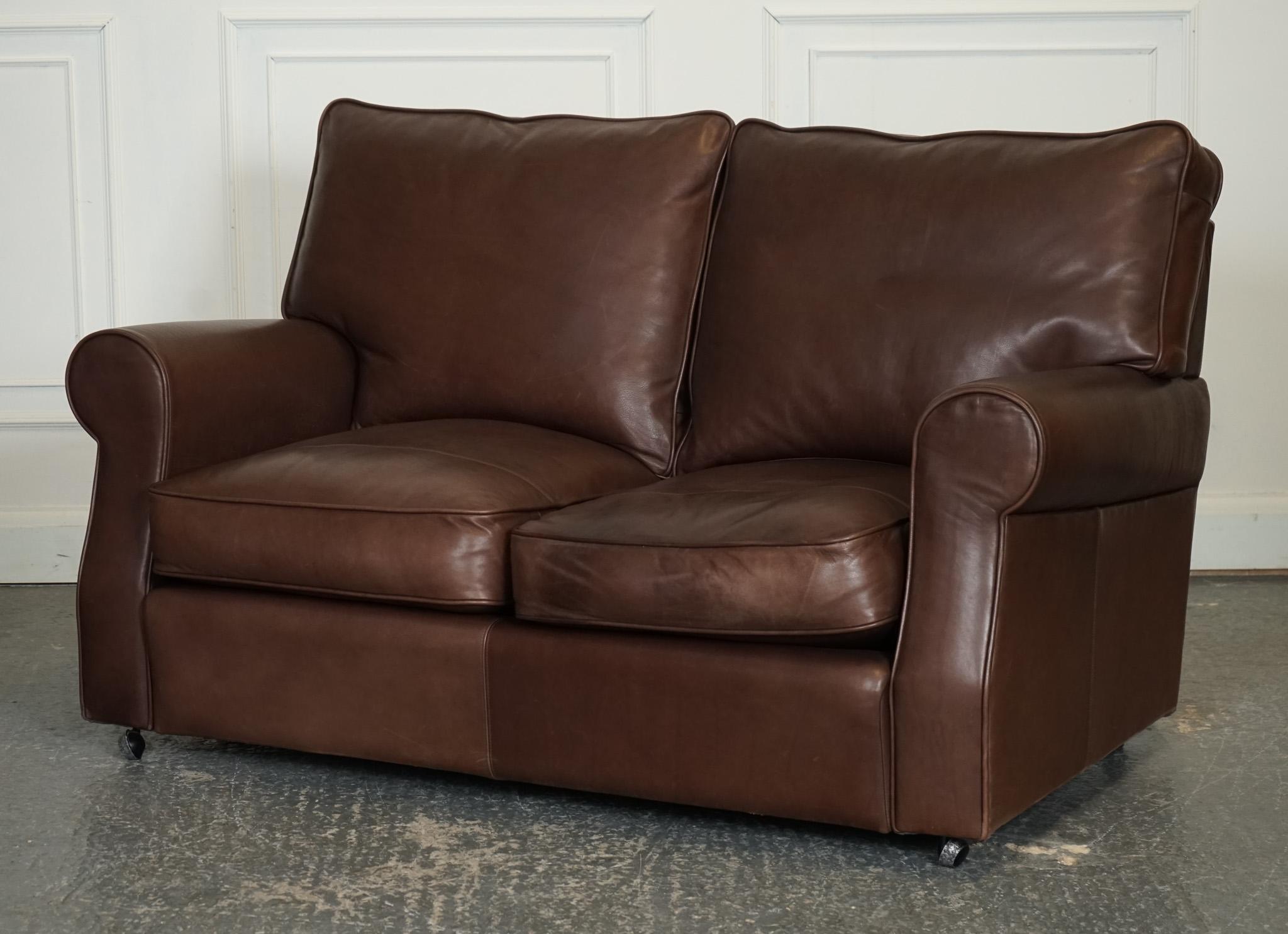 
We are delighted to offer for sale this Vintage Brown Leather Collins & Hayes Two to Three Seater Sofa.

 A luxurious and sophisticated piece of furniture that exudes timeless charm. This sofa is crafted from high-quality brown leather that adds