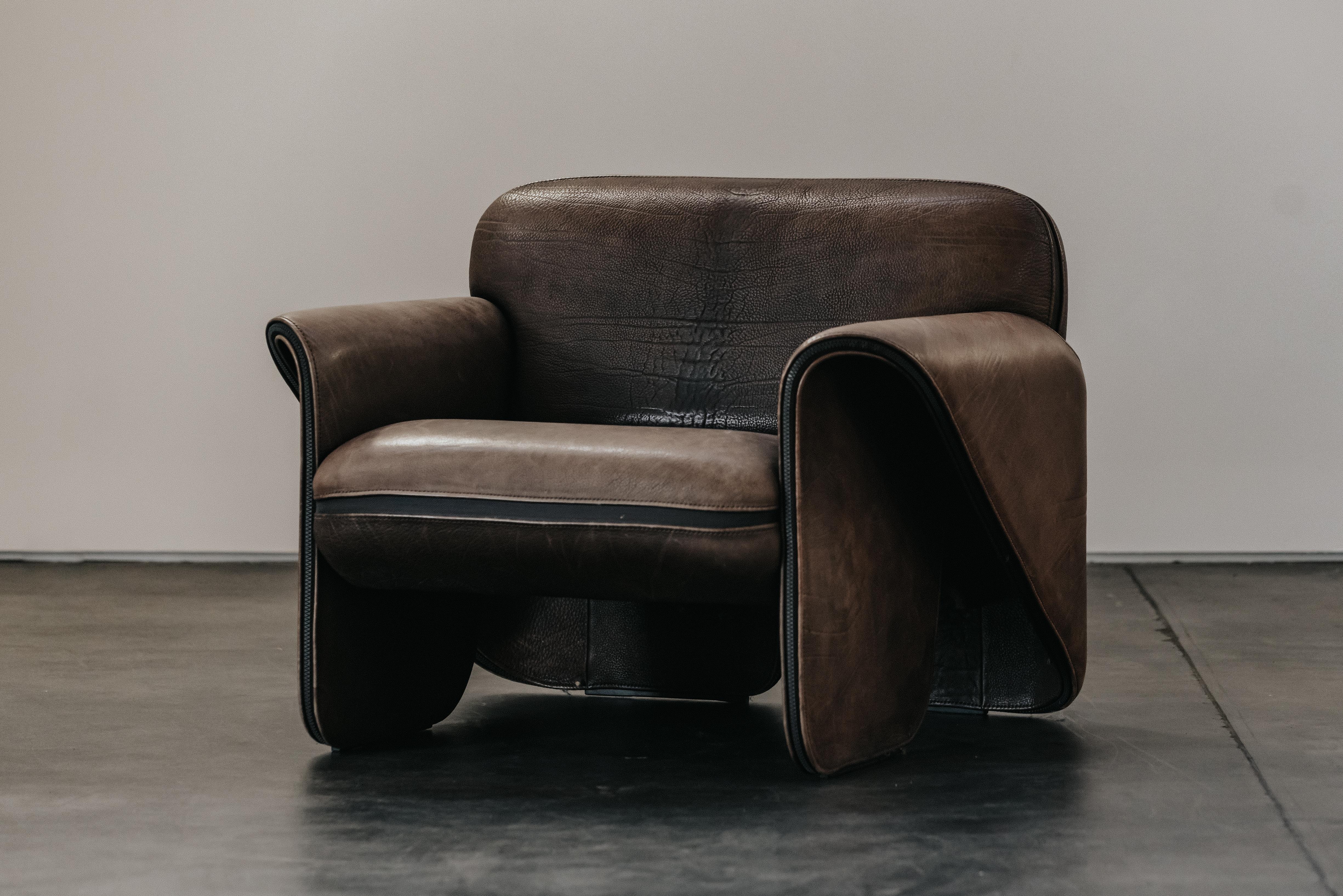 Vintage Brown Leather De Sede DS125 Lounge Chair From Switzerland, Circa 1970.  Original brown leather upholstery with fantastic patina and wear.