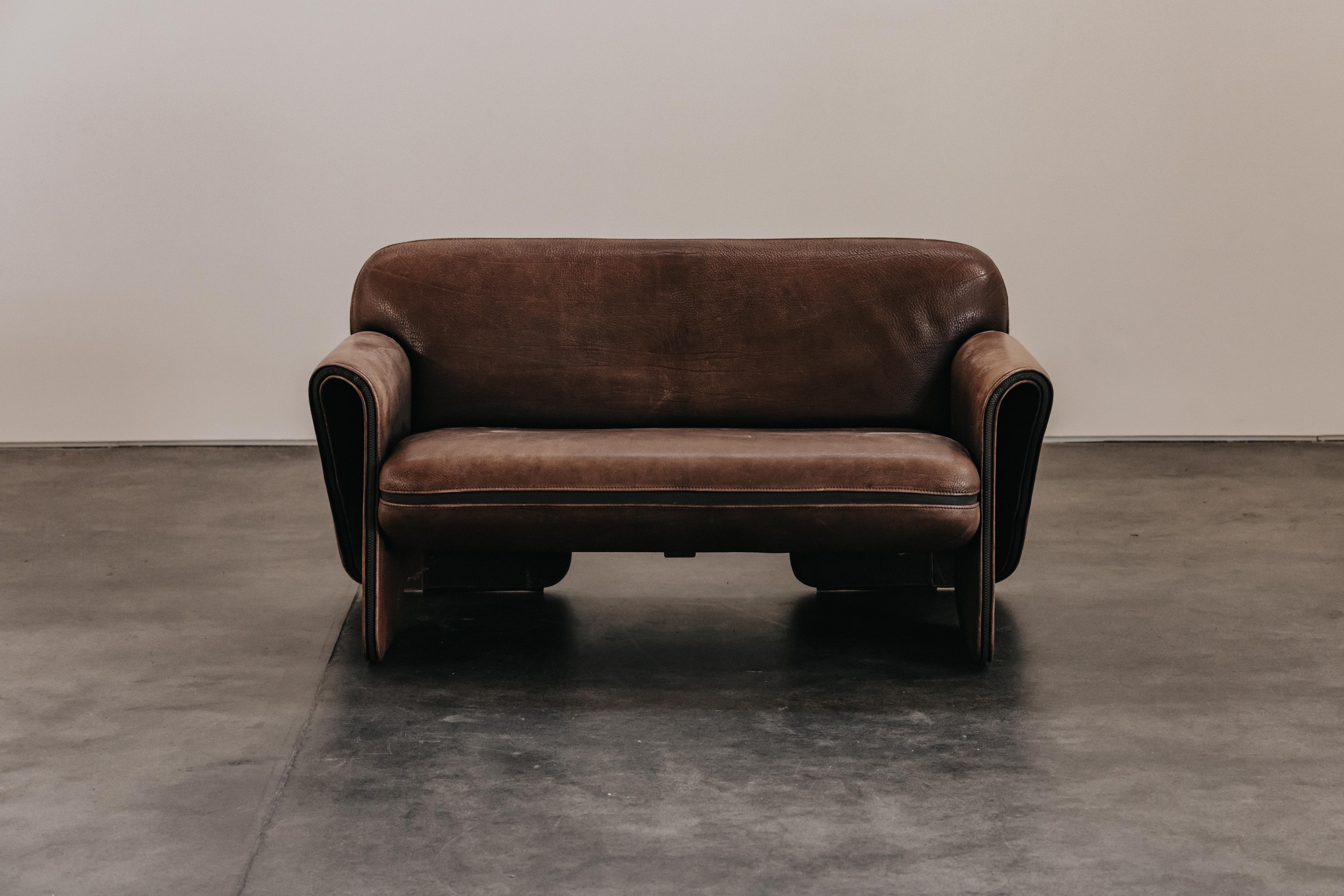 Vintage Brown Leather De Sede DS125 Sofa From Switzerland, Circa 1970.  Original brown leather upholstery with great wear and patina.