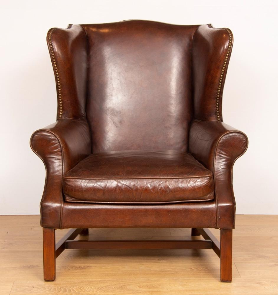 Vintage brown leather hide wing chair.
A lovely chocolate brown, full hide leather chair.

Really comfortable and spacious.