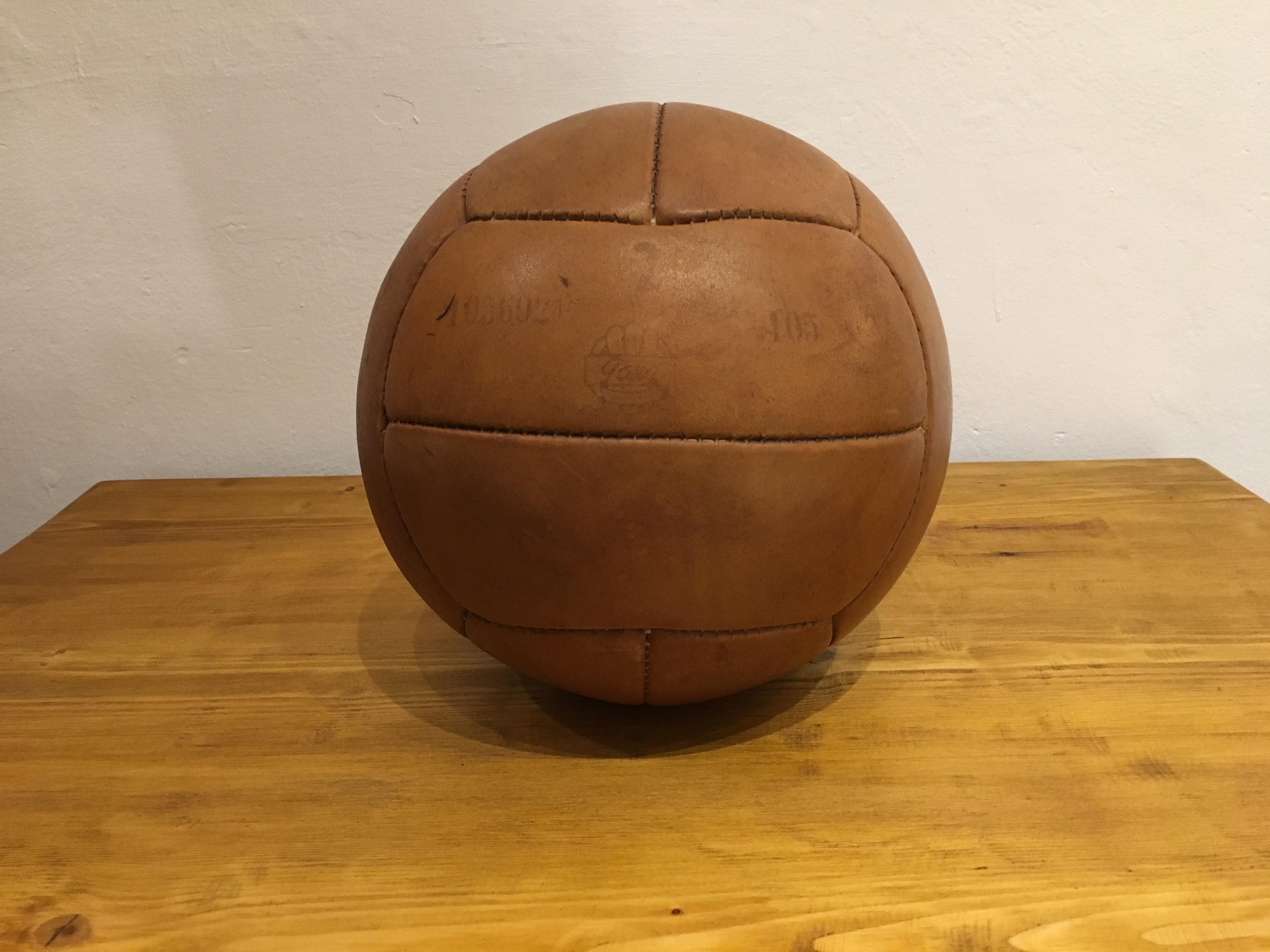 This medicine ball comes from the stock of an old Czech gymnasium. Made in the 1930s. Patina consistent with age and use. Cleaned and treated with a special leather care. Weight: 2kg. Measures: Diameter 9.4 inch.