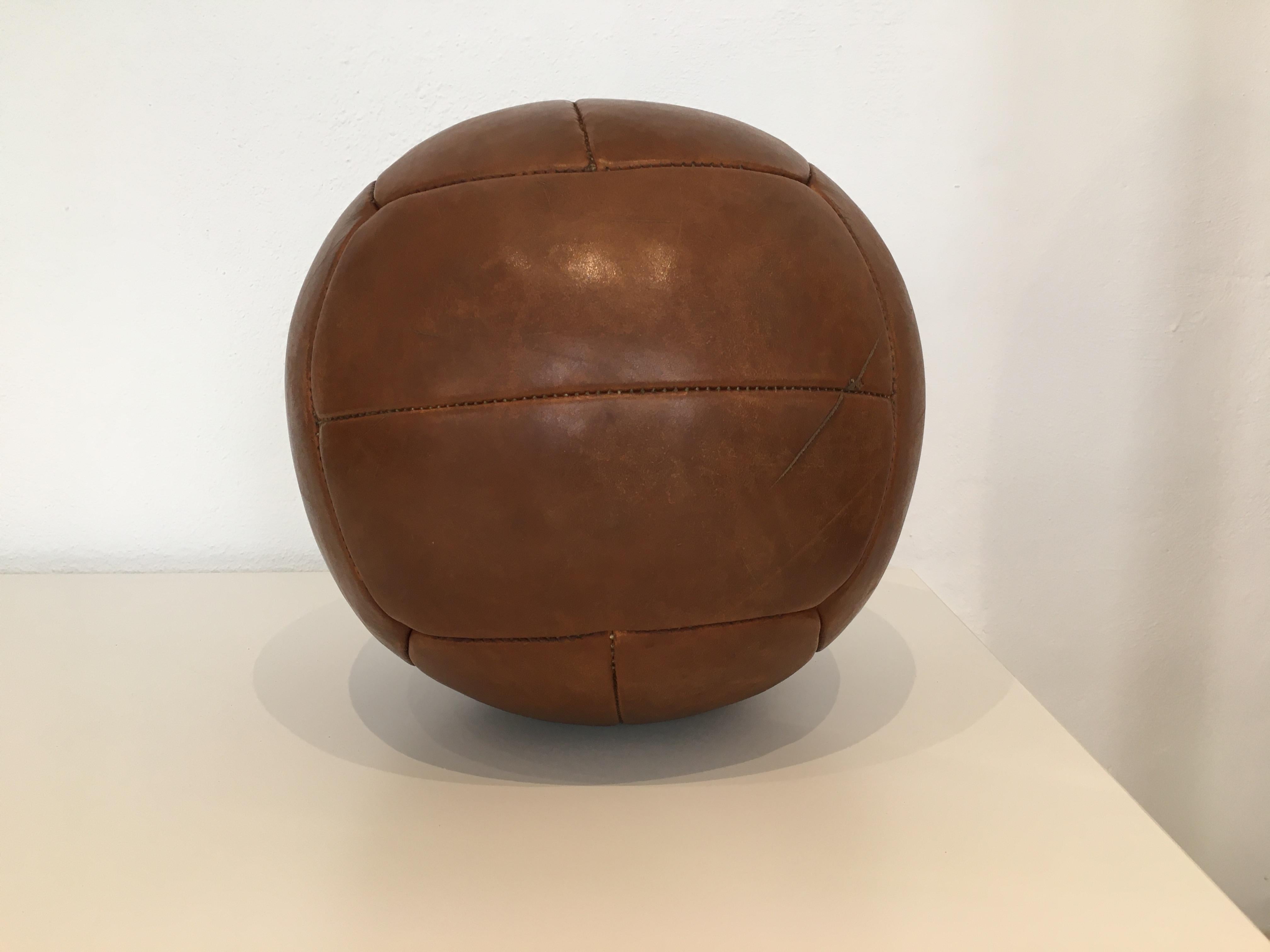 This medicine ball comes from the stock of an old Czech gymnasium. Made in the 1930s. Patina consistent with age and use. Cleaned and treated with a special leather care. Weight: 5kg. Measures: 12.99 inch.