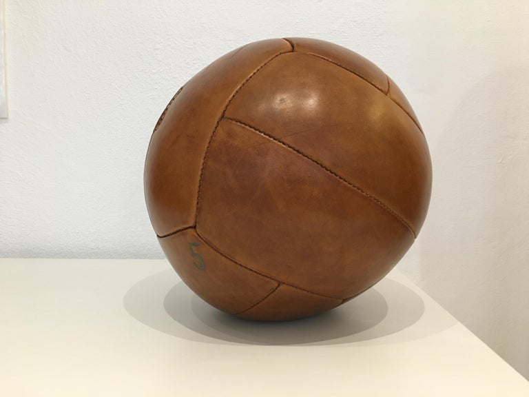 This medicine ball comes from the stock of an old Czech gymnasium. Made in the 1930s. Patina consistent with age and use. Cleaned and treated with a special leather care. Weight: 5kg. Measures: 12.99 inch.