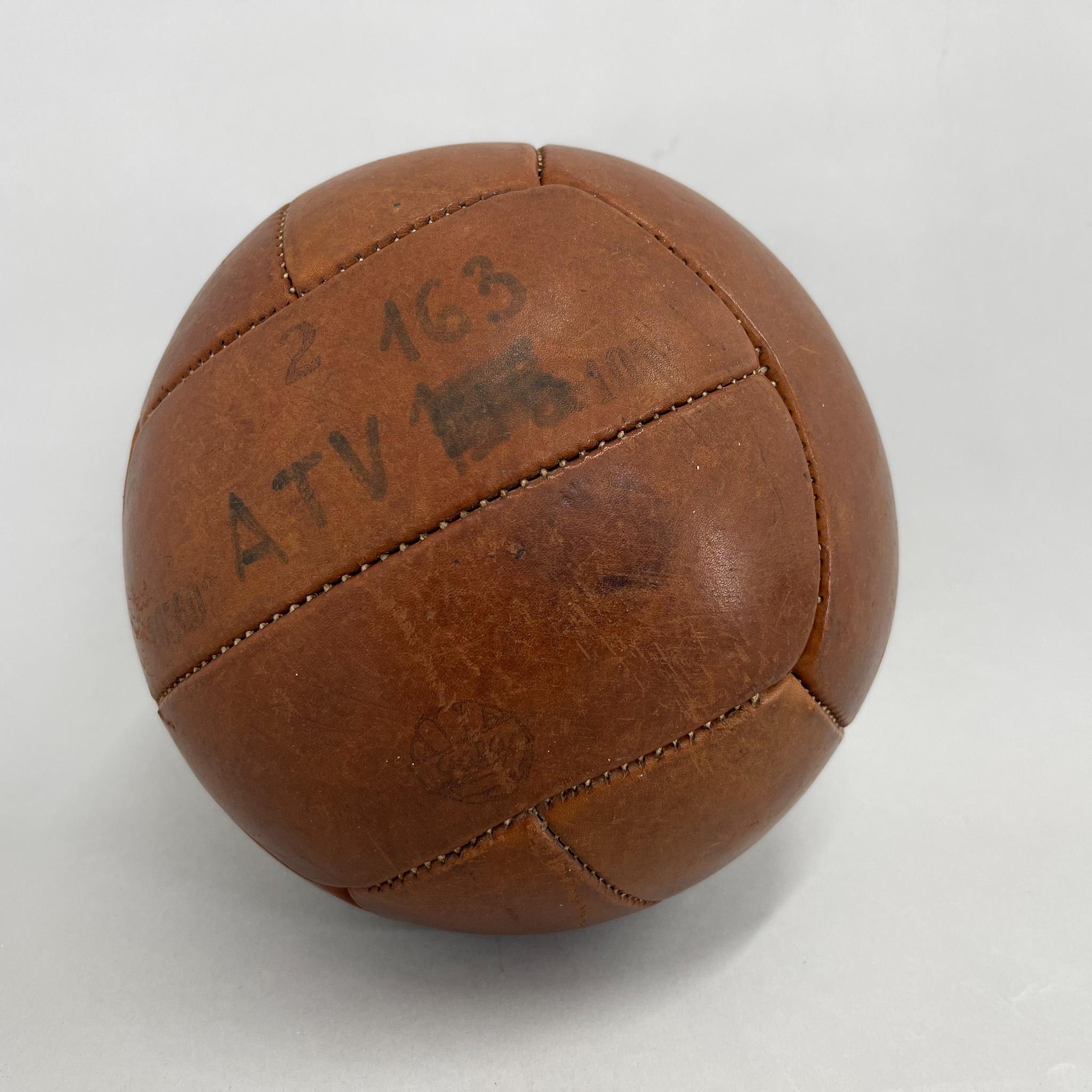 Original vintage heavy leather training ball with beautiful patina. The ball is made of handstitched genuine leather in former Czechoslovakia by Gala coompany in the 1930s. It can be used as an original interior accessory or as a stylish training
