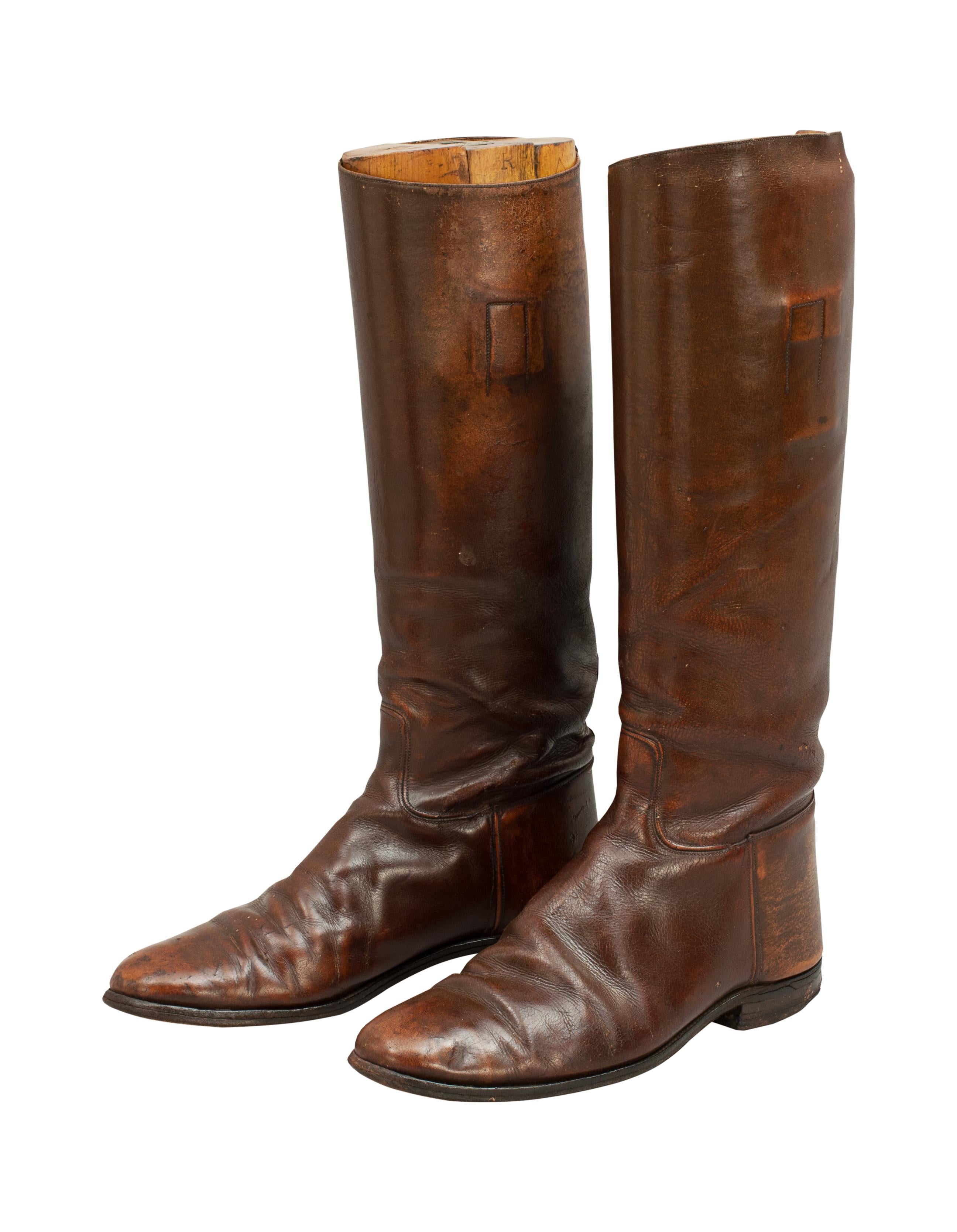 Brown leather riding boots.
A pair of English brown leather riding boots with wooden trees. The trees do not have handles and are not original to the boots. A great decorative pair of riding boots.