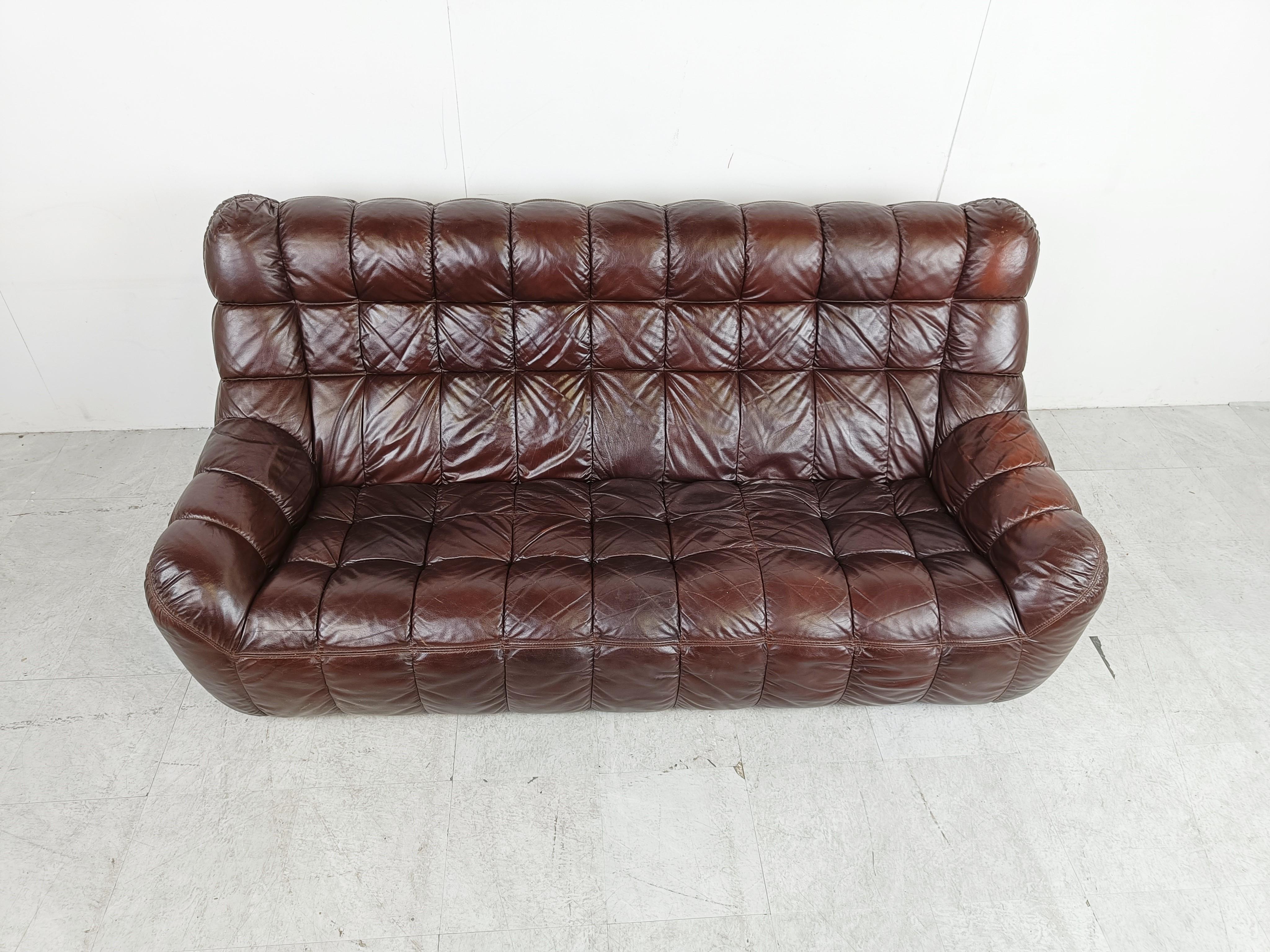 Vintage brown leather patchwork sofa.

The sofa is very light and comfortable being made from foam and leather. No metal or wooden structure inside the sofa just like Michel Ducaroys sofas.

Good condition wit normal age related wear. No rips holes