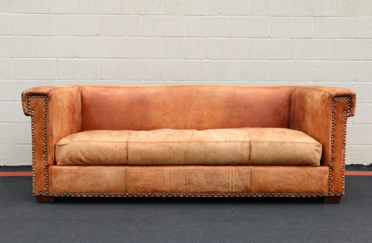 Amazing vintage sofa designed by Ralph Lauren for Henredon Furniture Ind., Inc. it has the labels on it. It is made of brown leather. Original from the late 20th Century. It is in vintage condition. It has some wear due to age and use. It has some