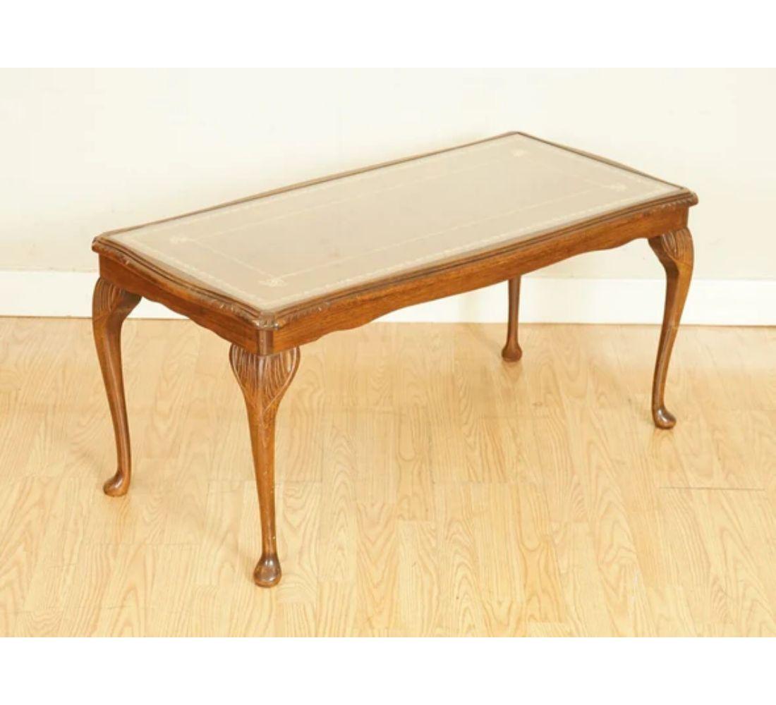 We are delighted to offer for sale this outstanding vintage Queen Anne brown leather top coffee table.

A very well-made and solid table, with a glass top to protect the leather.

We have lightly restored this by cleaning, hand waxed and hand