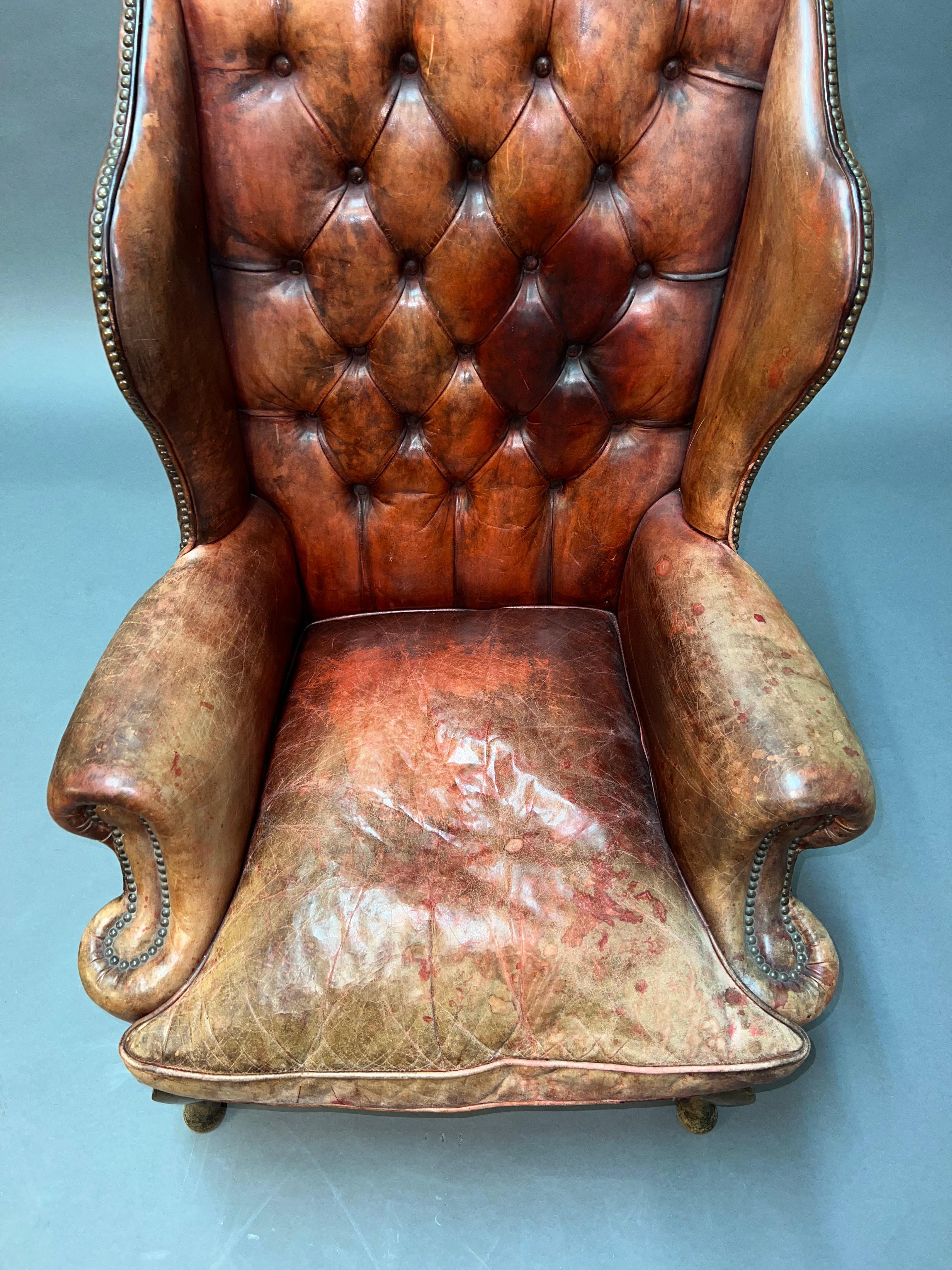 We are proud to have this stunning vintage Chesterfield brown leather choir chair for sale. This chair is a real tour de force, it has absolutely everything to offer, the leather skin is original and hand-dyed, the rivet work is all antiquated and
