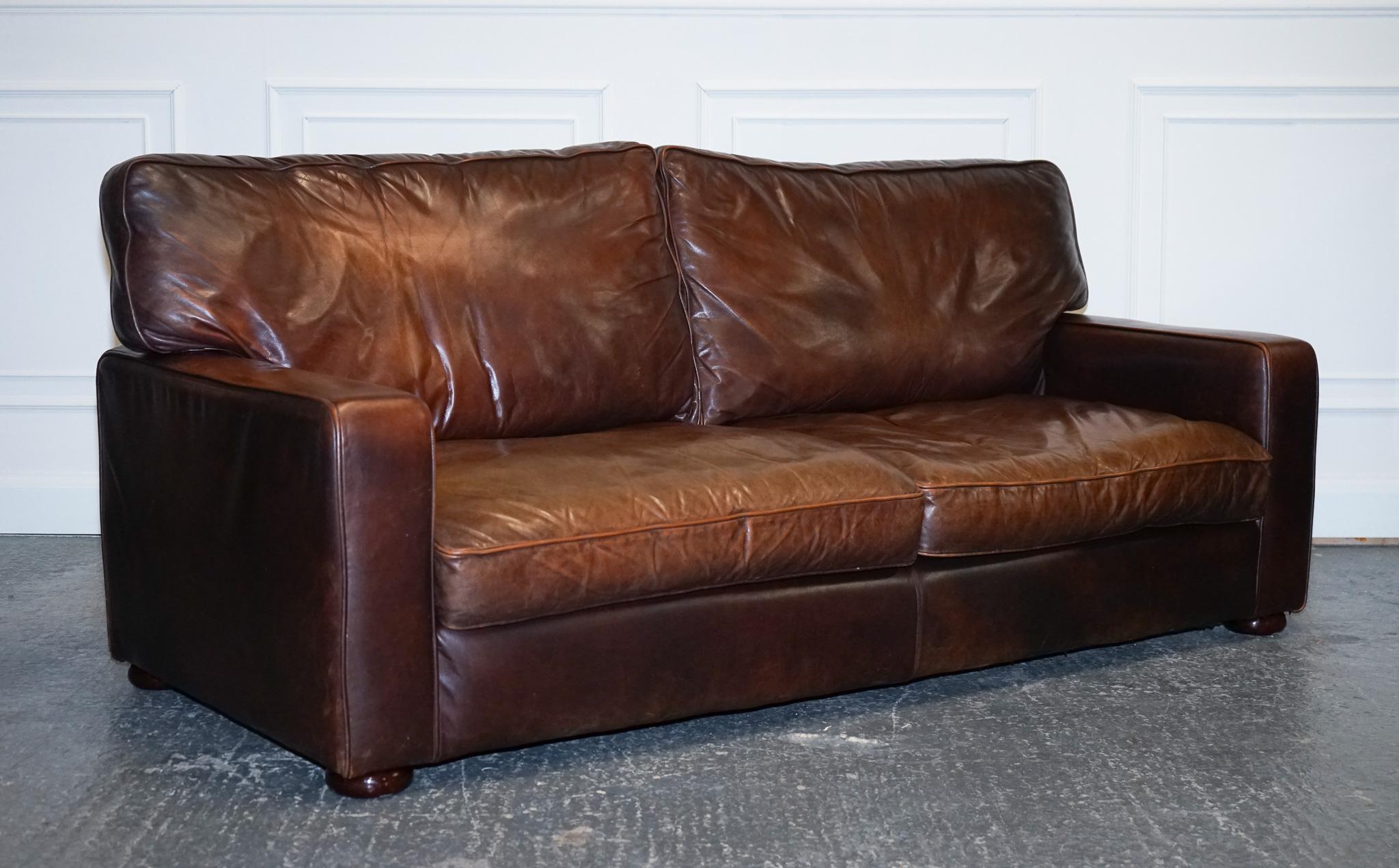 We are delighted to offer for sale this Lovely Vintage Brown Leather Two To Three Seater Sofa.

The leather feels very soft and the sofa sits very comfortably.
It is possible to screw off the legs of the sofa.

Also, the cushions are still very