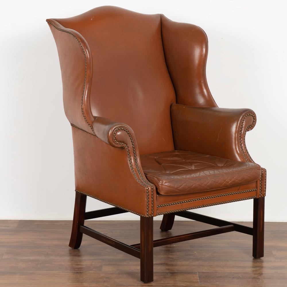 Vintage brown leather wingback arm chair with classic nail head trim.
Sold in vintage used condition. Frame is solid/stable and sits comfortably.
Leather shows signs of use such as scratches, creases, some discoloration, crackles/wear,etc.
Seat
