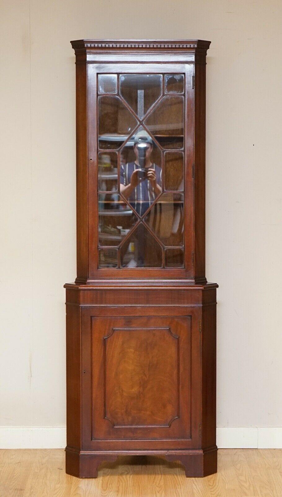 We are so excited to present to you this outstanding brown mahogany astragal glazed corner cabinet.

It has a key to lock the doors, a very well made piece.

We have lightly restored this by giving it a hand clean all over, hand waxed and hand