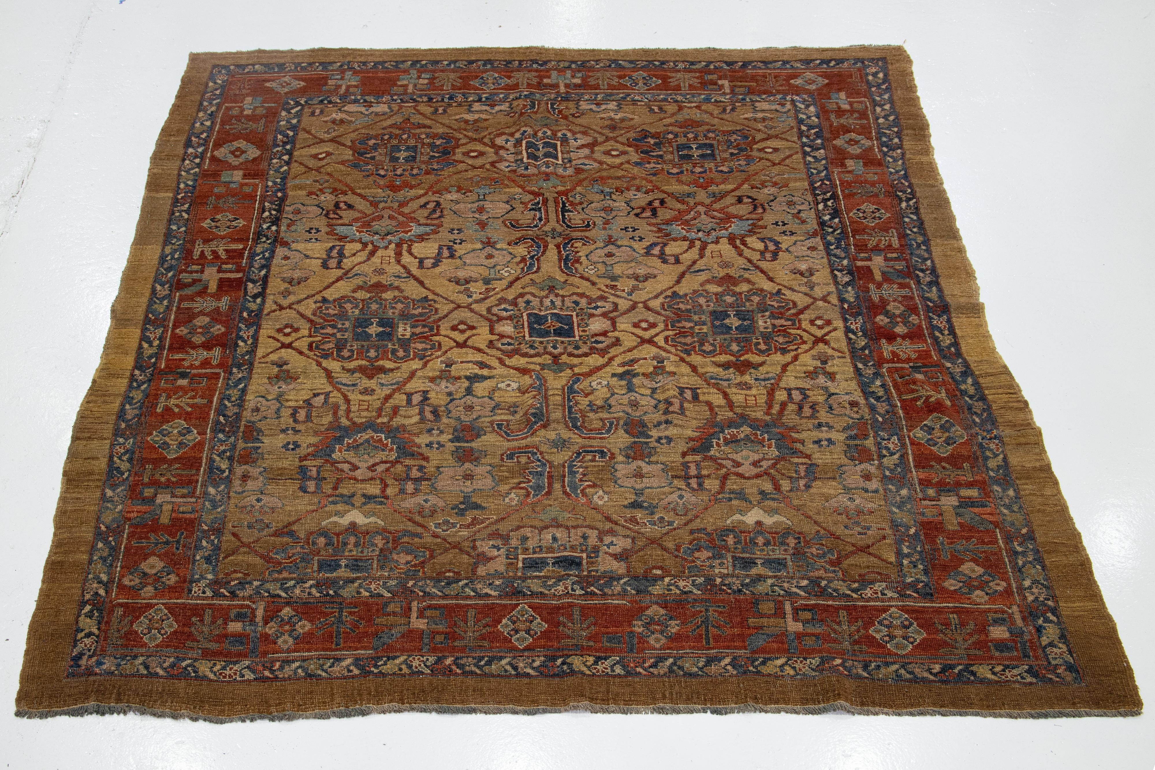 Preciosa alfombra persa vintage Bakshaish de lana anudada a mano, con el campo de color canela y detalles multicolores en un diseño tribal integral. 


Esta alfombra mide 8'2