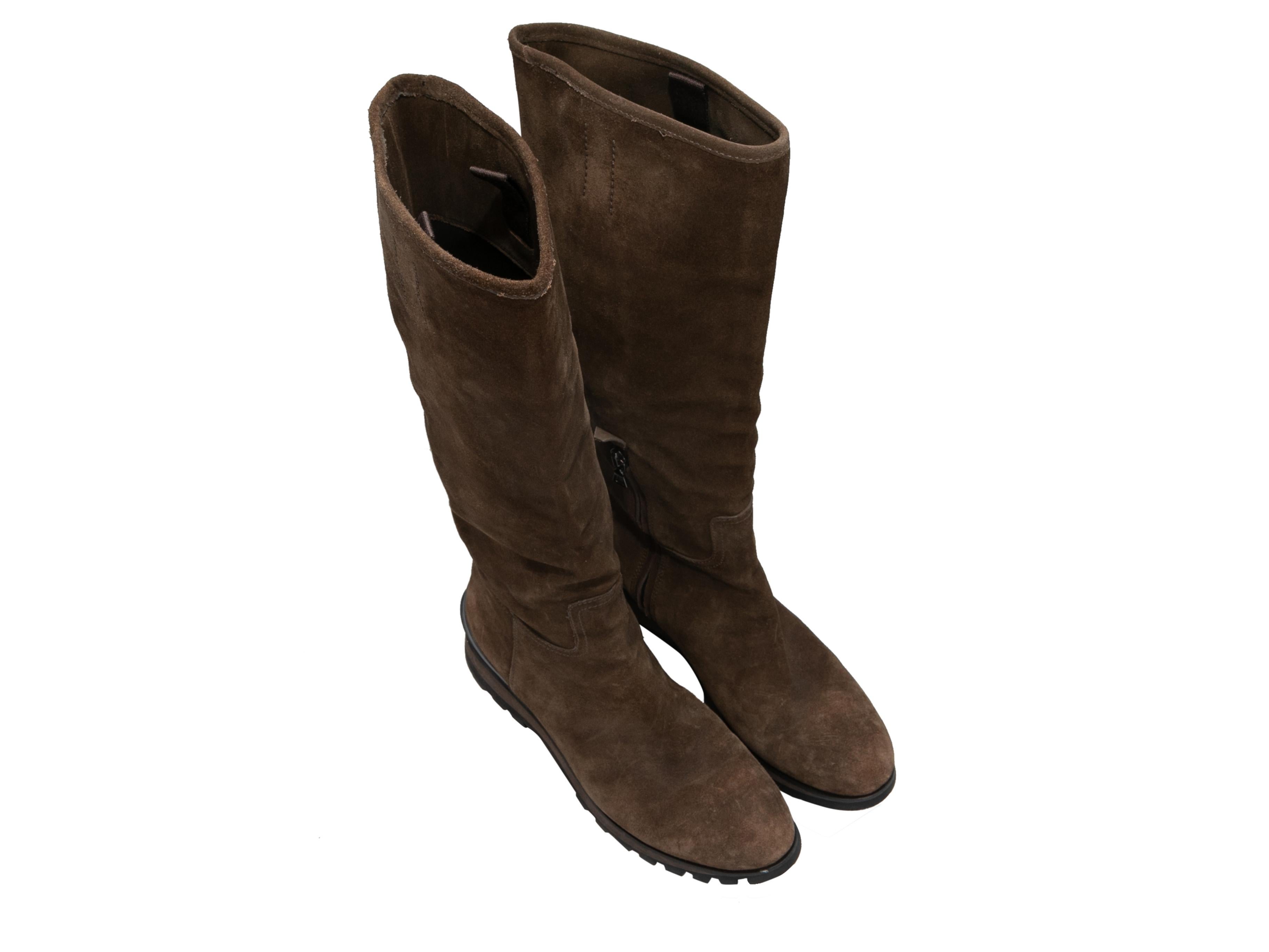 Vintage brown suede knee-high boots by Prada. Circa 1990s. Low wedge heels. Zip closures at inner sides. 14.5
