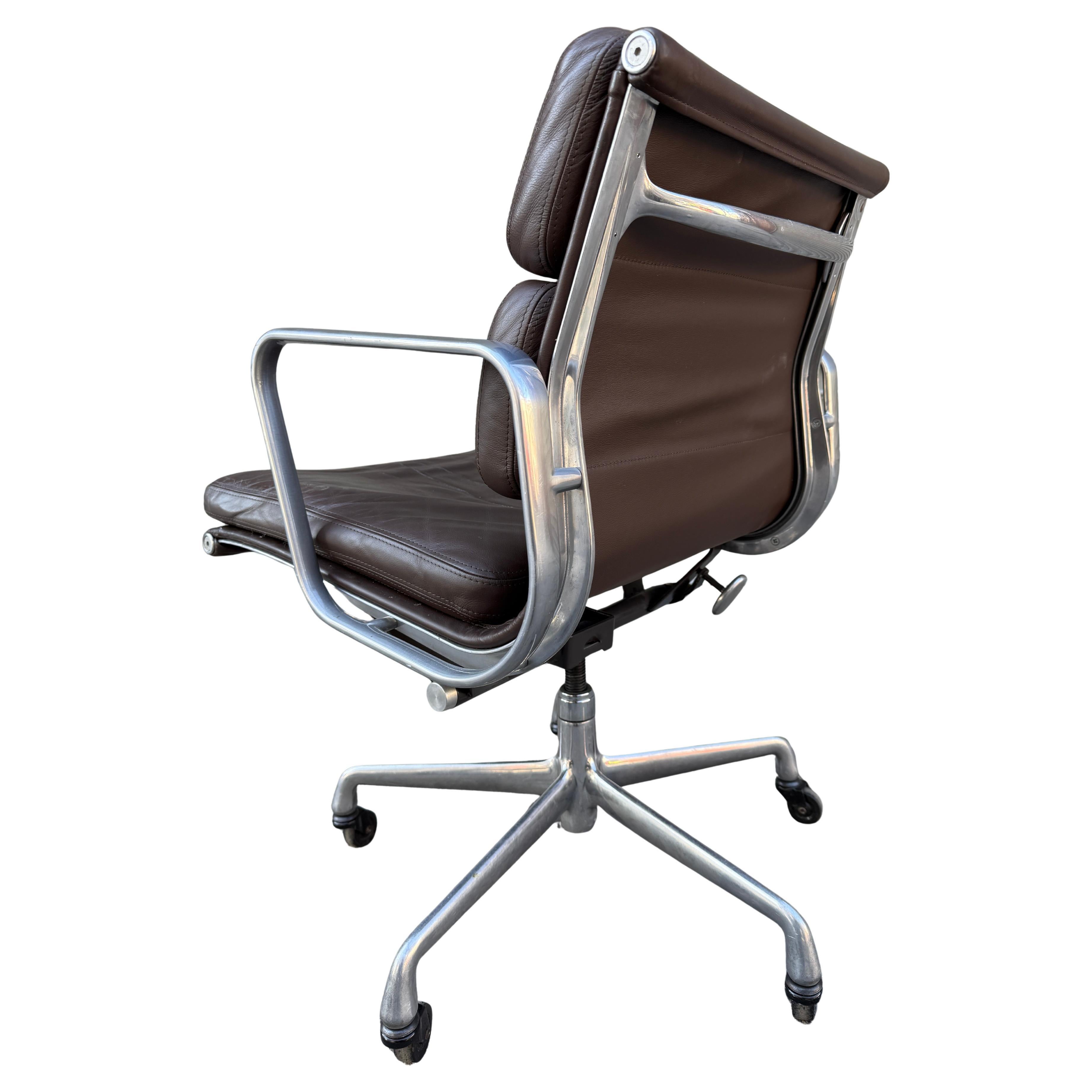 For your consideration is this authentic vintage Eames for Herman Miller vintage soft pad chair in brown leather circa 2000. Adjustable tilt and height with manual lift. These authentic examples are icons of Mid-Century Modern design. Eames aluminum