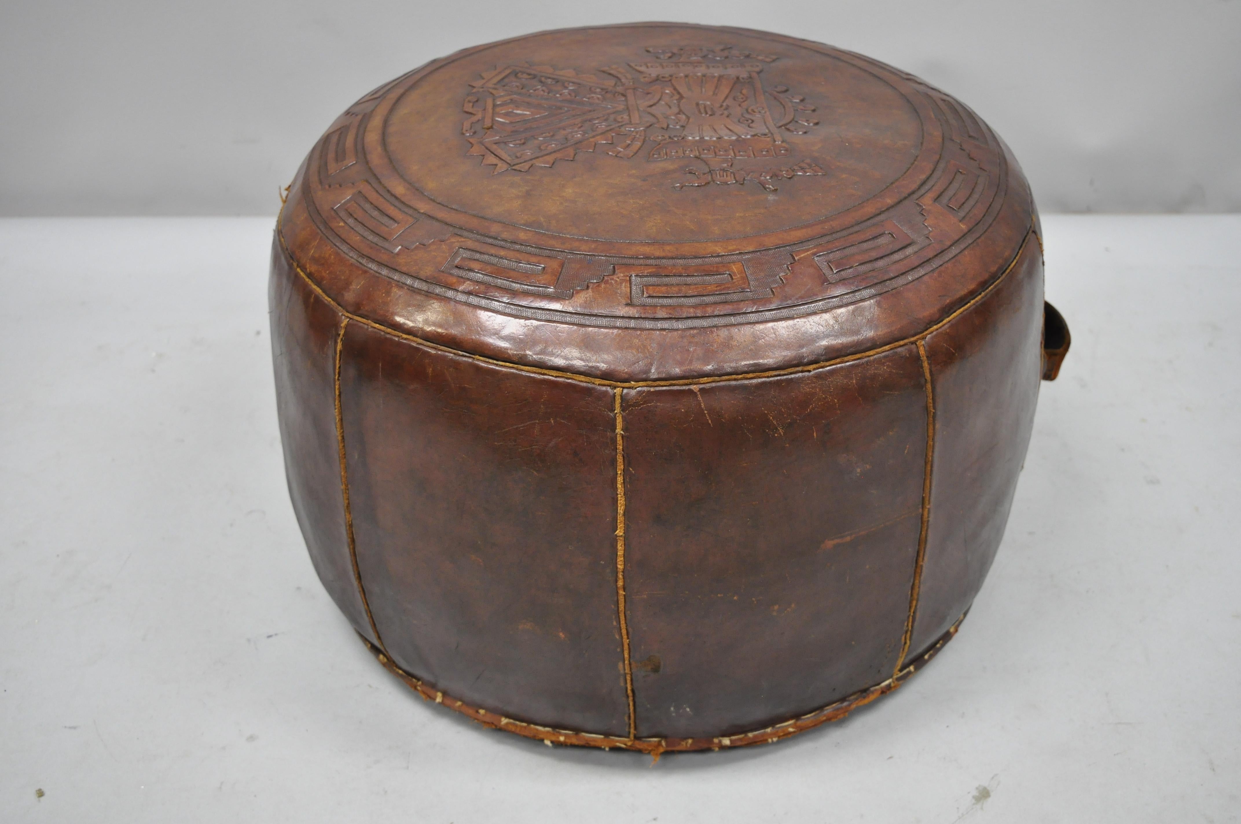 Vintage Brown Tooled Saddle Leather Peruvian Ottoman Hassock with Handle In Good Condition In Philadelphia, PA