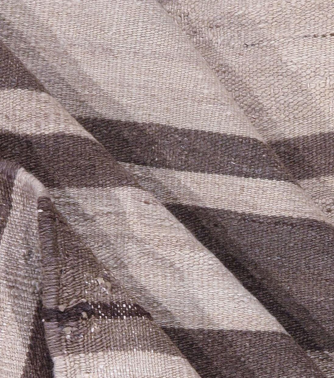 5'1 x 10'4. This vintage Turkish flat-weave Kilim was handwoven in the 1950s.The simplicity and boldness of these pieces can also give a contemporary feel and can look at home in both a modern or traditional setting. 