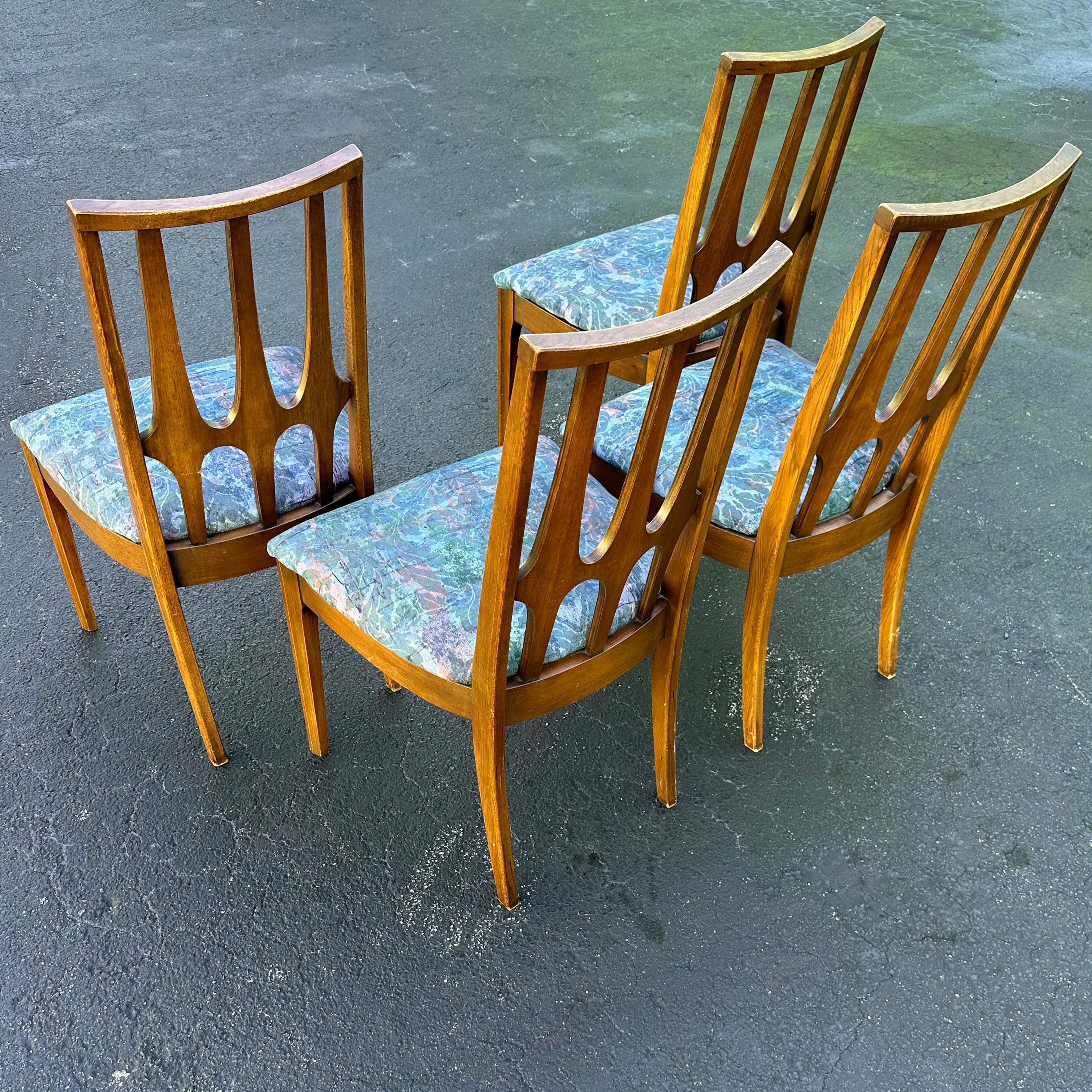 Mid-Century Modern Brasilia set of 4 dining chairs by Broyhill. Originally designed in the 1960s, based on the designs of architect Oscar Niemeyer coming from the capital city of Brazil, Brasilia. Good vintage condition with some wear from age and
