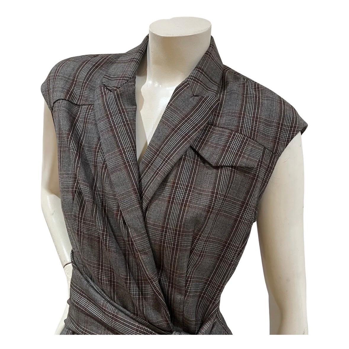Vintage Plaid Jumpsuit by Brunello Cucinelli
Made in Italy
Dark gray and red plaid throughout 
Sleeveless
Collared 
Faux bust pocket 
Front snap closure to waist 
Side zipper closure
Attached waist tie
Dual side pant pockets
Dual back pant pockets 