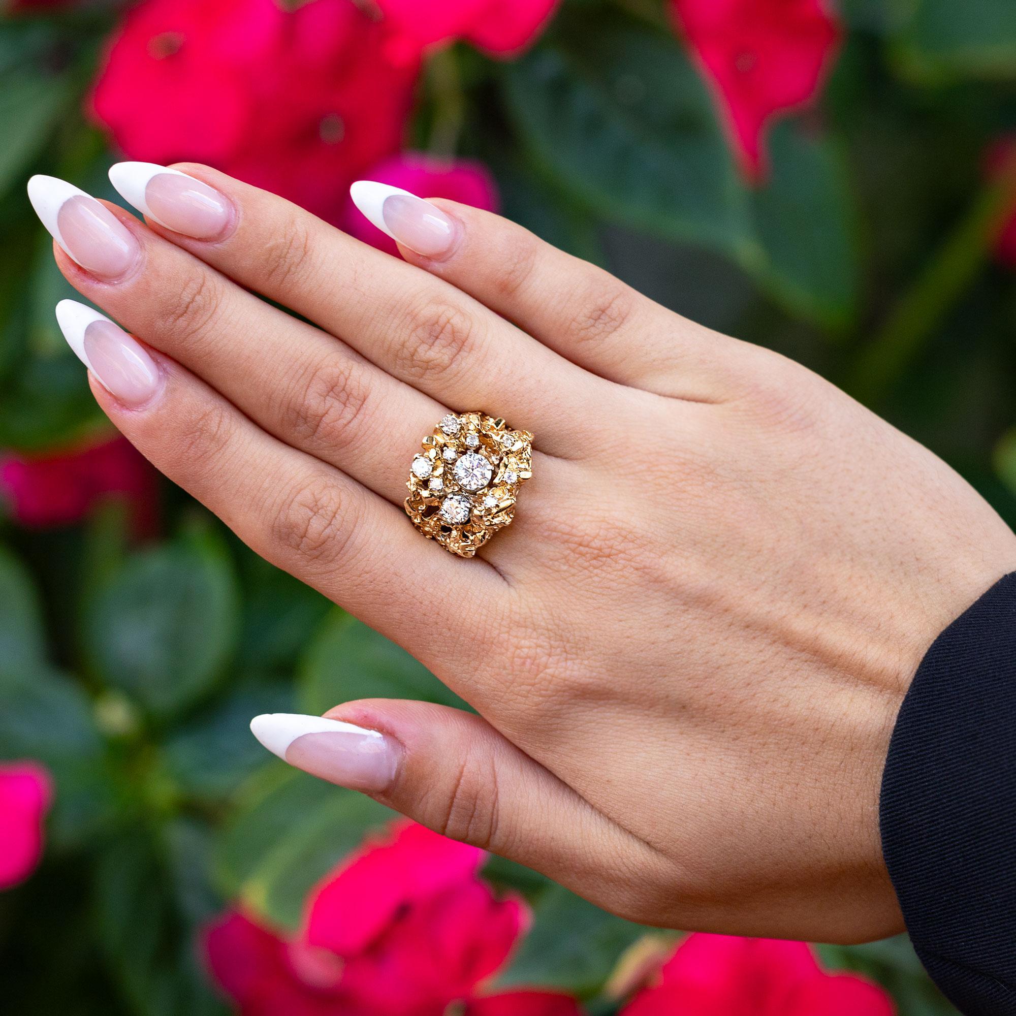 A glamorous, vintage 14 karat gold nugget diamond cluster ring, with brutalist thematics and old world charm. This estate cocktail ring is lively with 10 antique diamonds, together weighing 1 carat total. Uniquely crafted with a look of organically