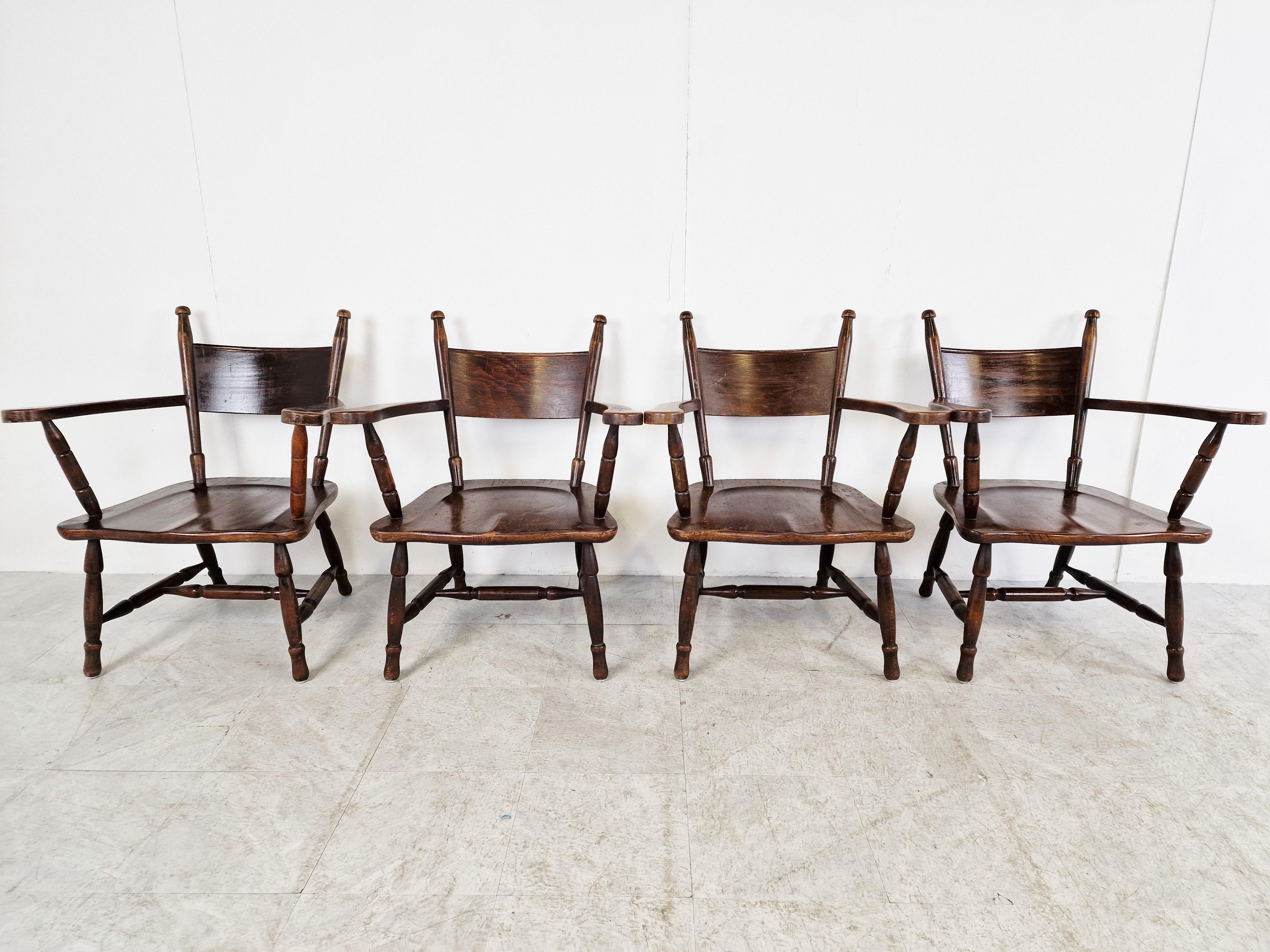 Sturdy stained oak brutalist armchairs.

Well crafted chairs with a nicely shaped seat, and beautifully curved armrests.

The frames are nicely sculpted.

1960s - France

Good condition with normal age related wear

Dimensions
Height: