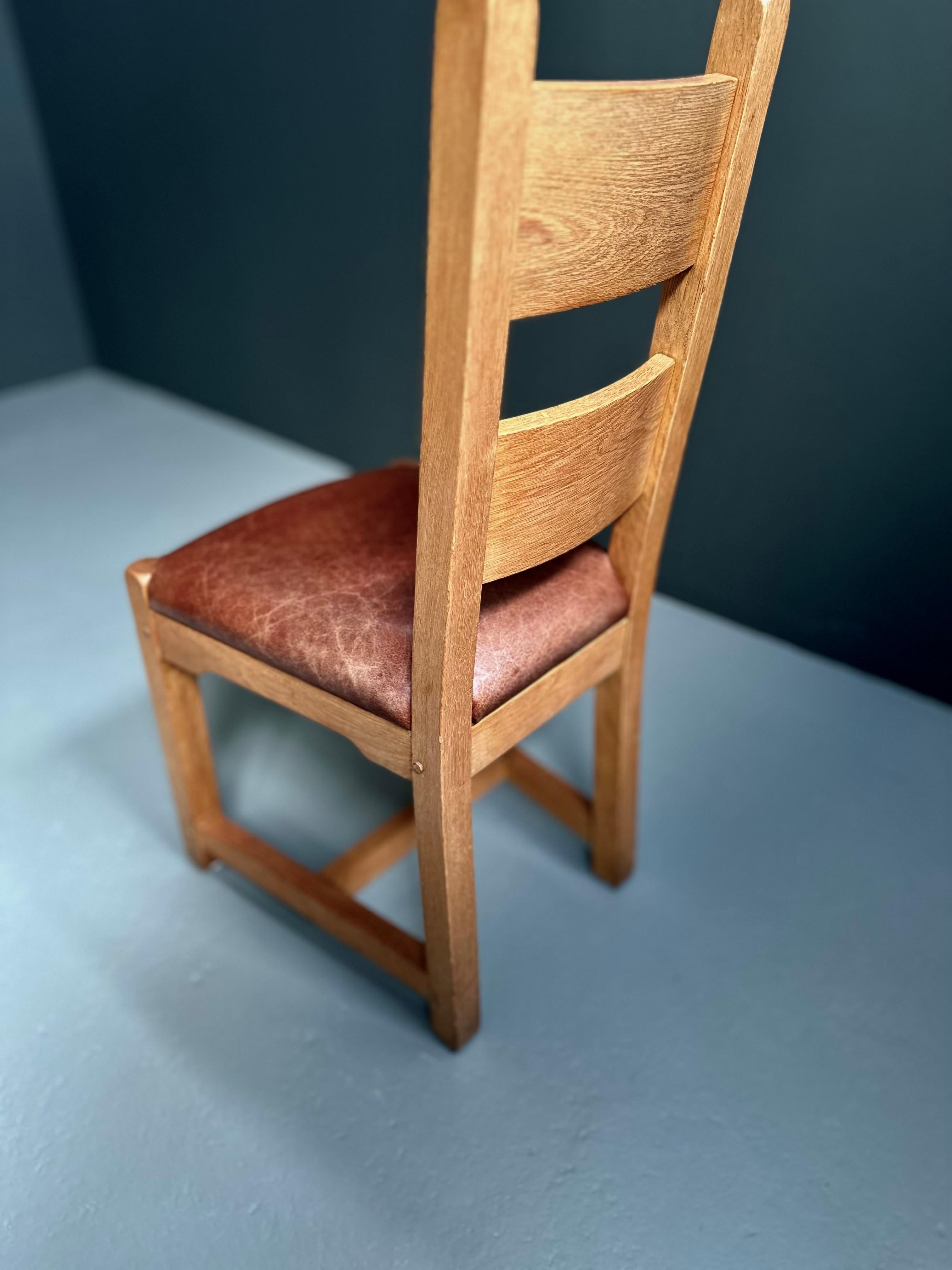Solid oak and patinated leather dining chairs.

Brutalist style.

Very sturdy frames with thick leather seats.

1960s - France

Dimensions:
Height: 106cm
Width: 45cm
Depth: 47cm
Seat height: 47cm

*Price is for the set
*Images are always part of the