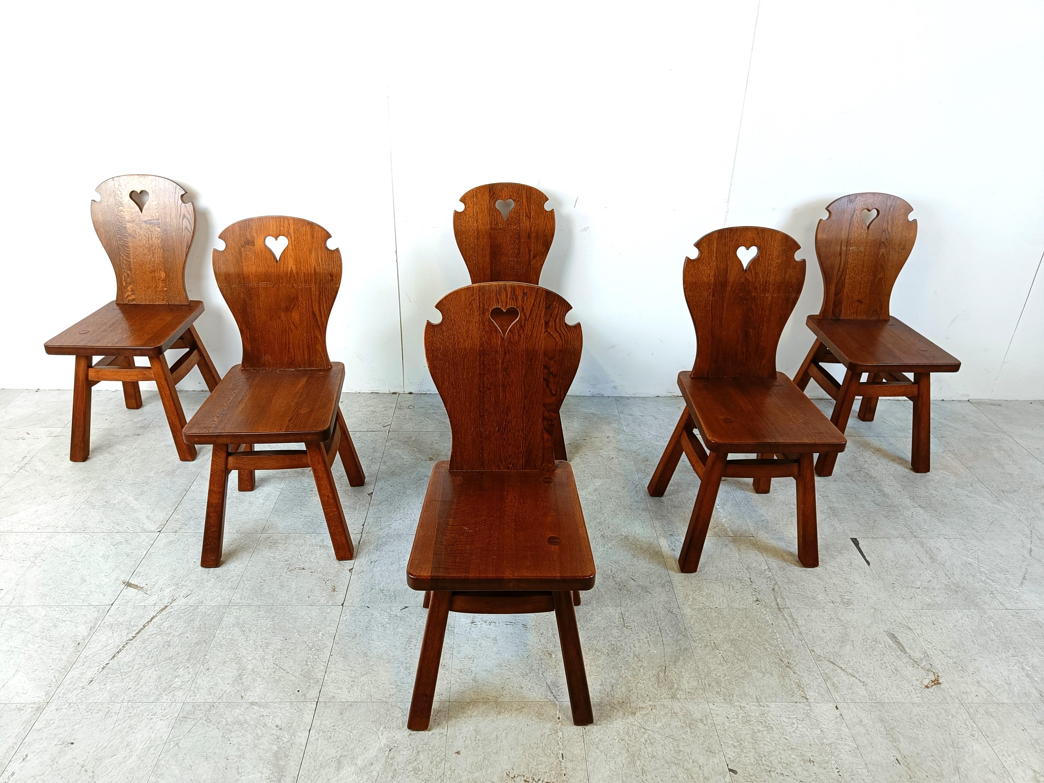 Mid century solid wooden  brutalist dining chairs.

Nice rustic design with heartt shaped cutouts in the back.

Very sturdy chairs

Good original condition.

1960s - Sweden

Dimensions:
Height: 90cm
Seat height: 45cm
Width: 40cm
Depth: 45cm

Ref.: