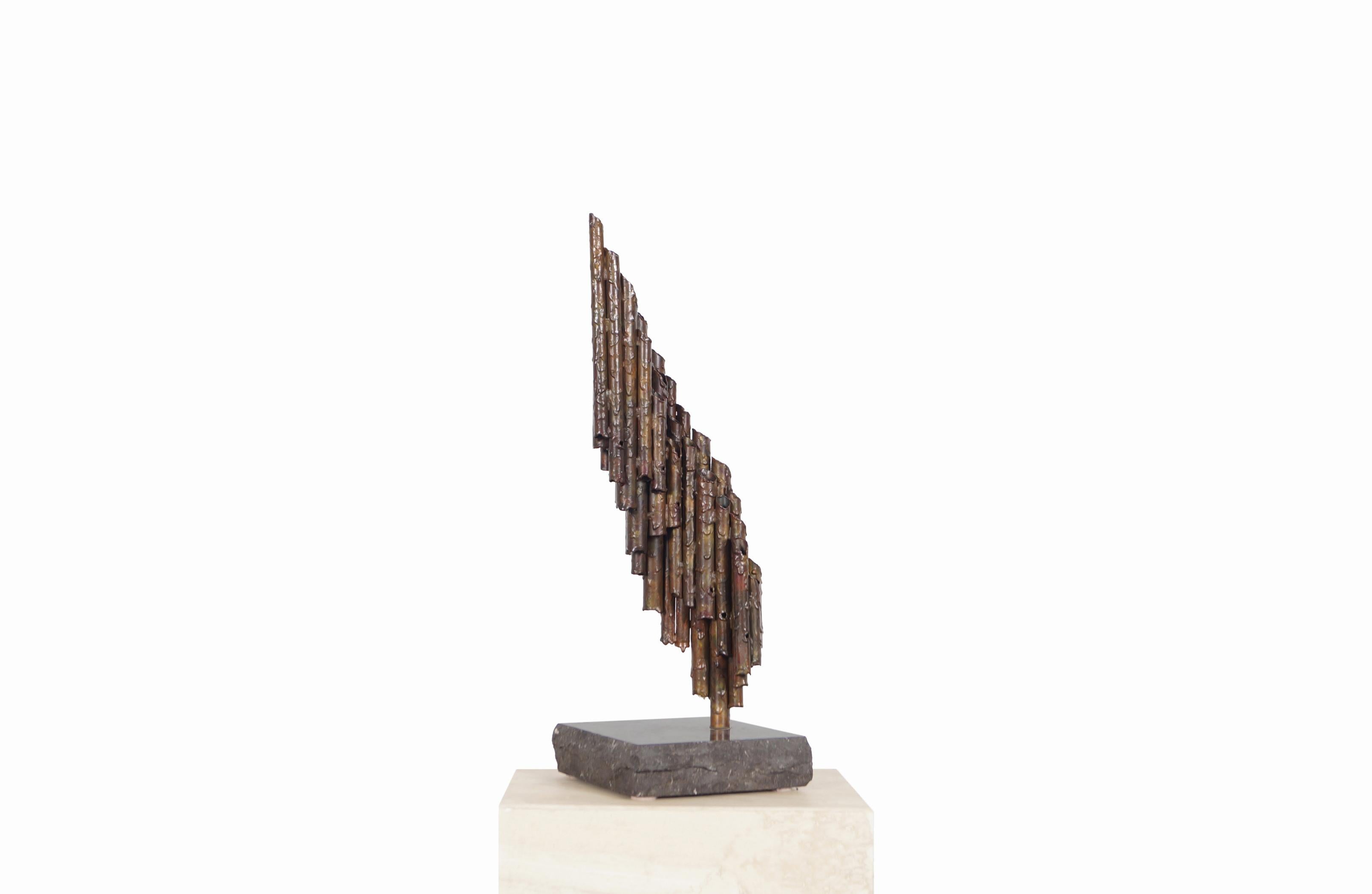 Exceptional vintage brutalist metal sculptured designed in United States, circa 1970s. This sculpture is made up of metal tubes that give the impression that the construction material in each tube is melting. Each tube is arranged in the shape of a