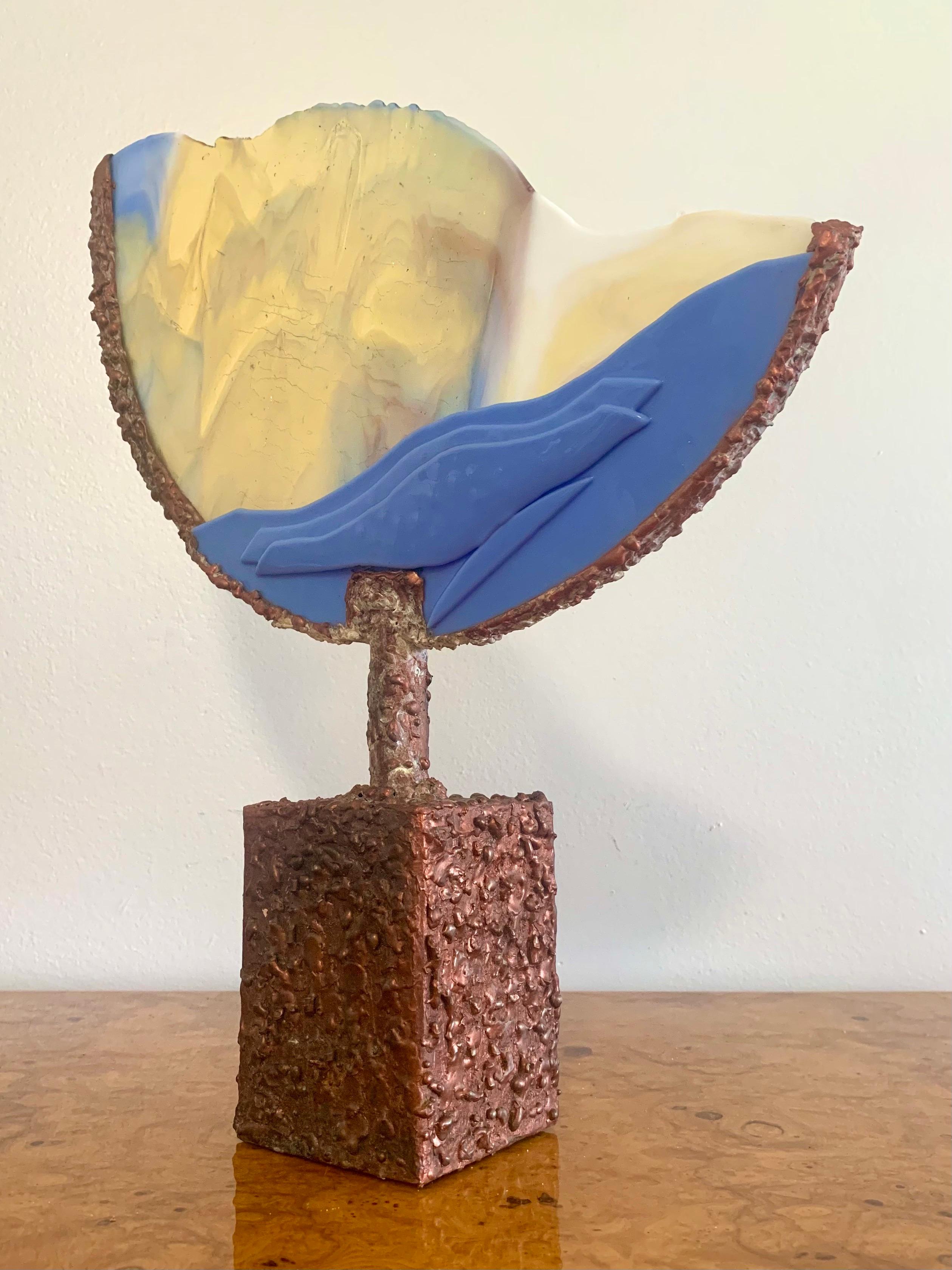 Handmade mixed media sculpture. Done in a mid century brutalist style. Phenomenal mix of textures between the welded metals and smooth glass. Gorgeous array of colors in the glass piece. Small split in the backside near the base.