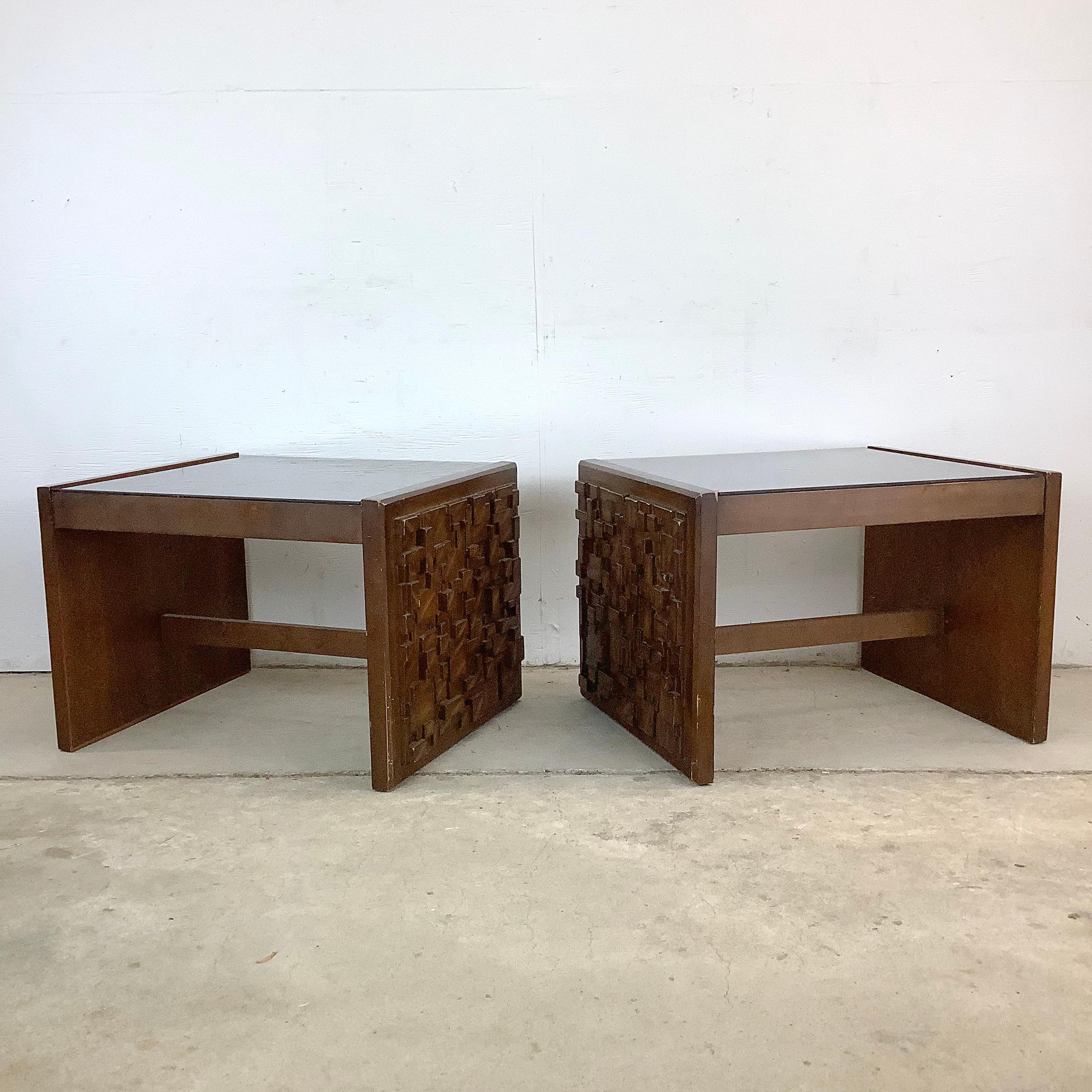 Pair of vintage Brutalist Modern end tables, attributed in style to Paul Evans and reminiscent of Lane Furniture’s Staccato series. Featuring sculptural cubist carved wood panels, each table reflects the bold experimentation of American modern