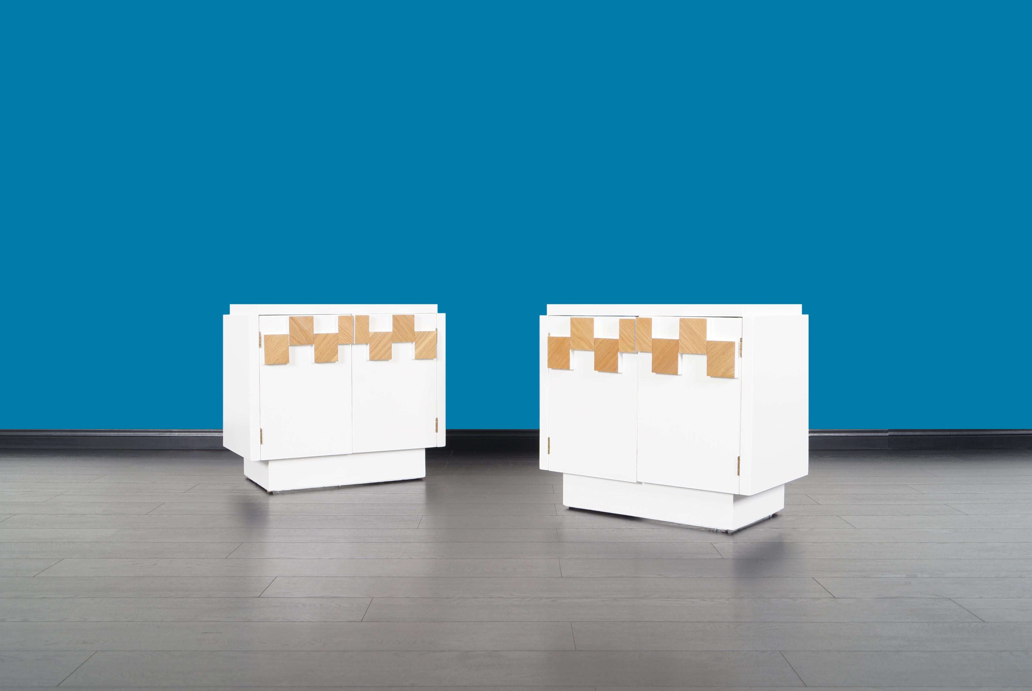 Stunning pair of vintage Brutalist mosaic nightstands manufactured by Lane in the United States. Each table comes with two doors and a fixed shelf inside, all integrated with geometric shapes on the front side. Its versatility allows it to serve as