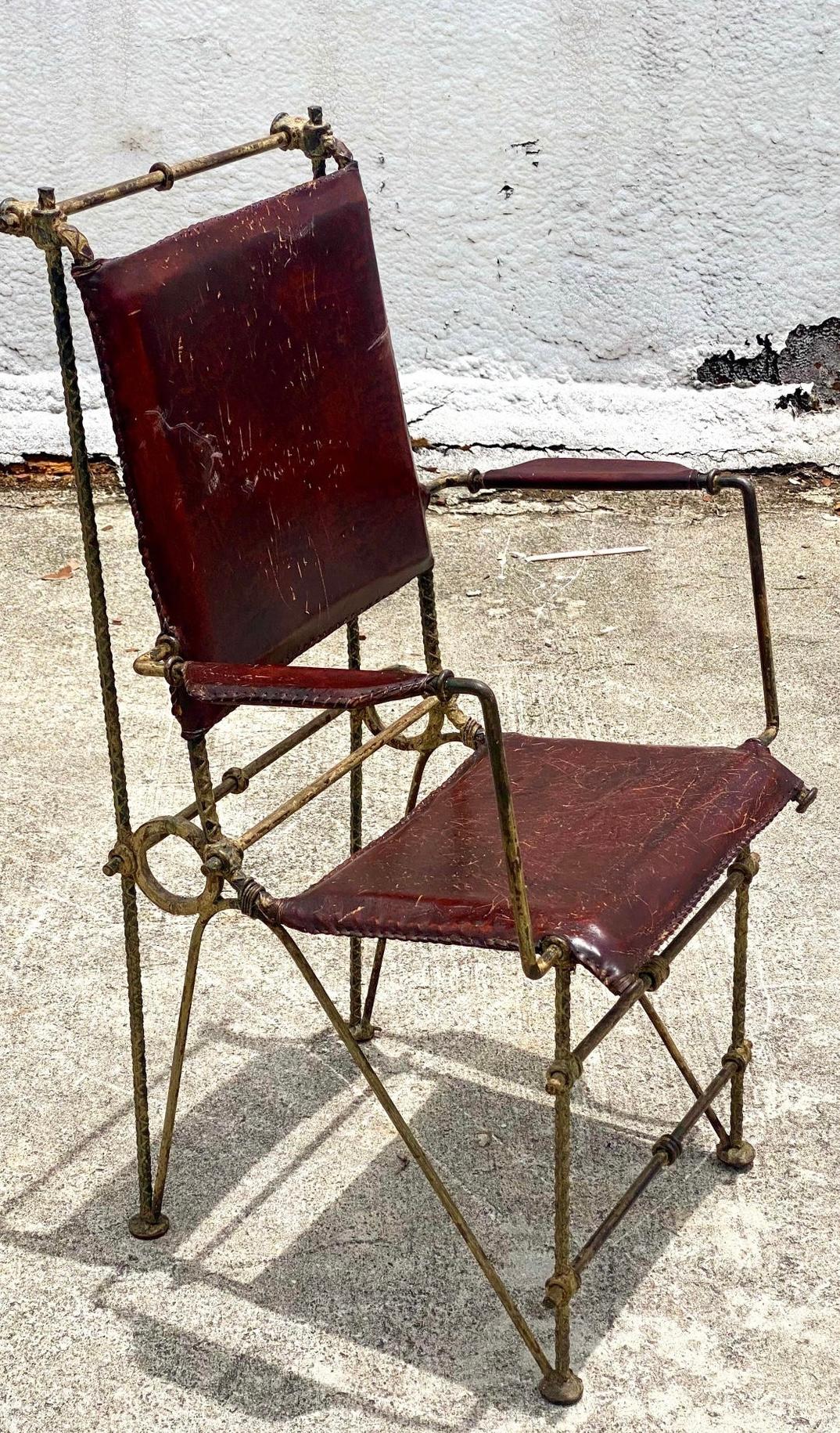 Striking vintage set of 6 Brutalist dining chairs. Made in the manner of Ilana Goor. Heavy distressed rebar sculpted into the most brilliant designs. Distressed leather seats. Acquired from a Palm Beach estate.