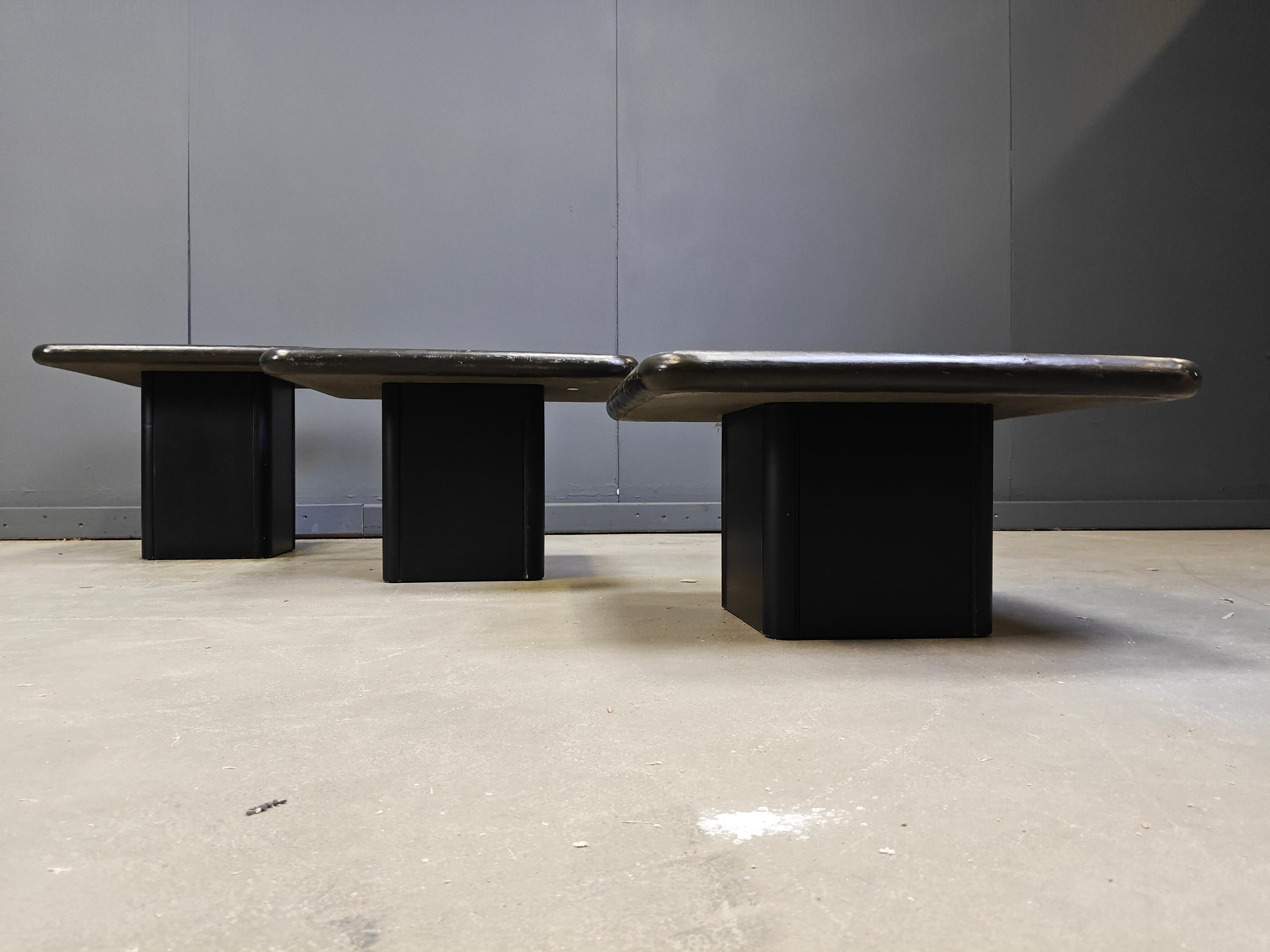 Seventies brutalist slate stone nesting tables or side tables in the manner of Marcus Kingma by C. Kneip, 1991

Slate stone table tops with inlaid stones and brass materials

1990s - Germany

Dimensions:
Largest table: 45cm
Width x depth: