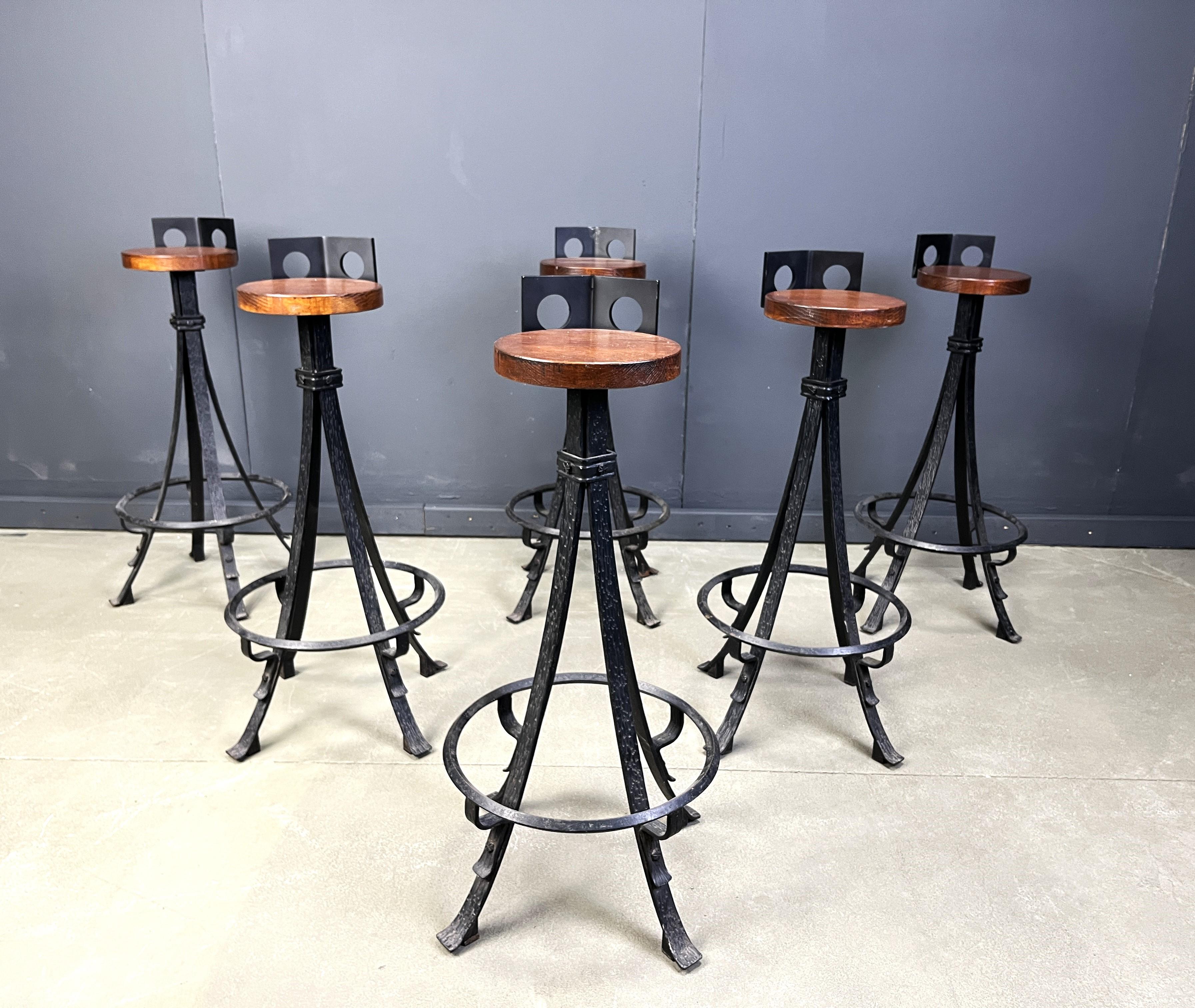 Vintage brutalist bar stools with solid wooden seats and beautifully crafted wrought iron bases. 

1960s  - Germany

Very good, sturdy condition

Dimensions:
Height: 92cm
Width: 40cm
Depth: 40cm
Seta height: 82cm

Ref.: 2504100202

*Price is for the