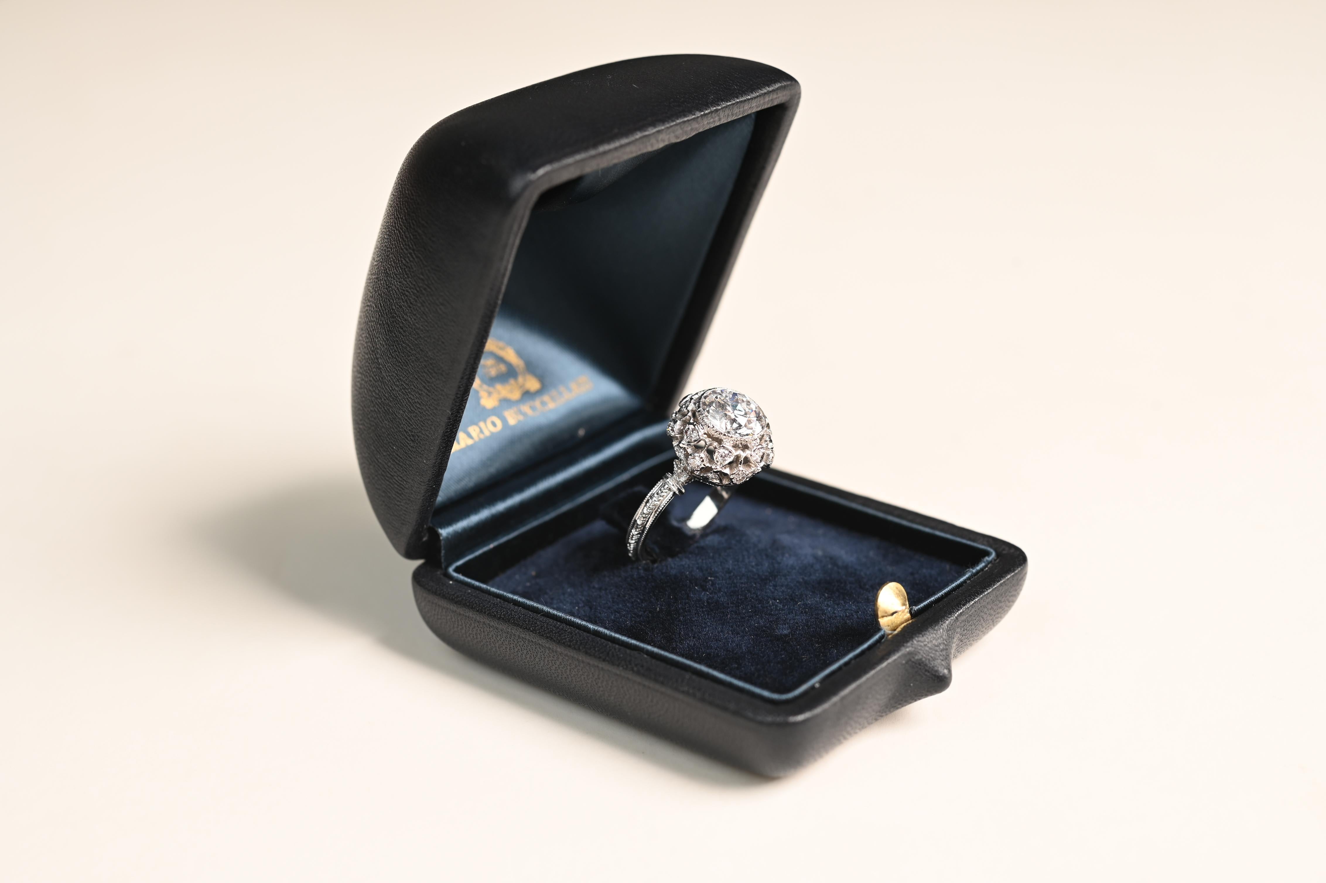 Presenting a breathtaking vintage Buccellati diamond engagement ring, masterfully handcrafted in Italy circa 1960. At its center lies a bezel-set old European cut diamond, GIA-certified at an impressive Approx. 2.20-Carats, boasting exceptional E