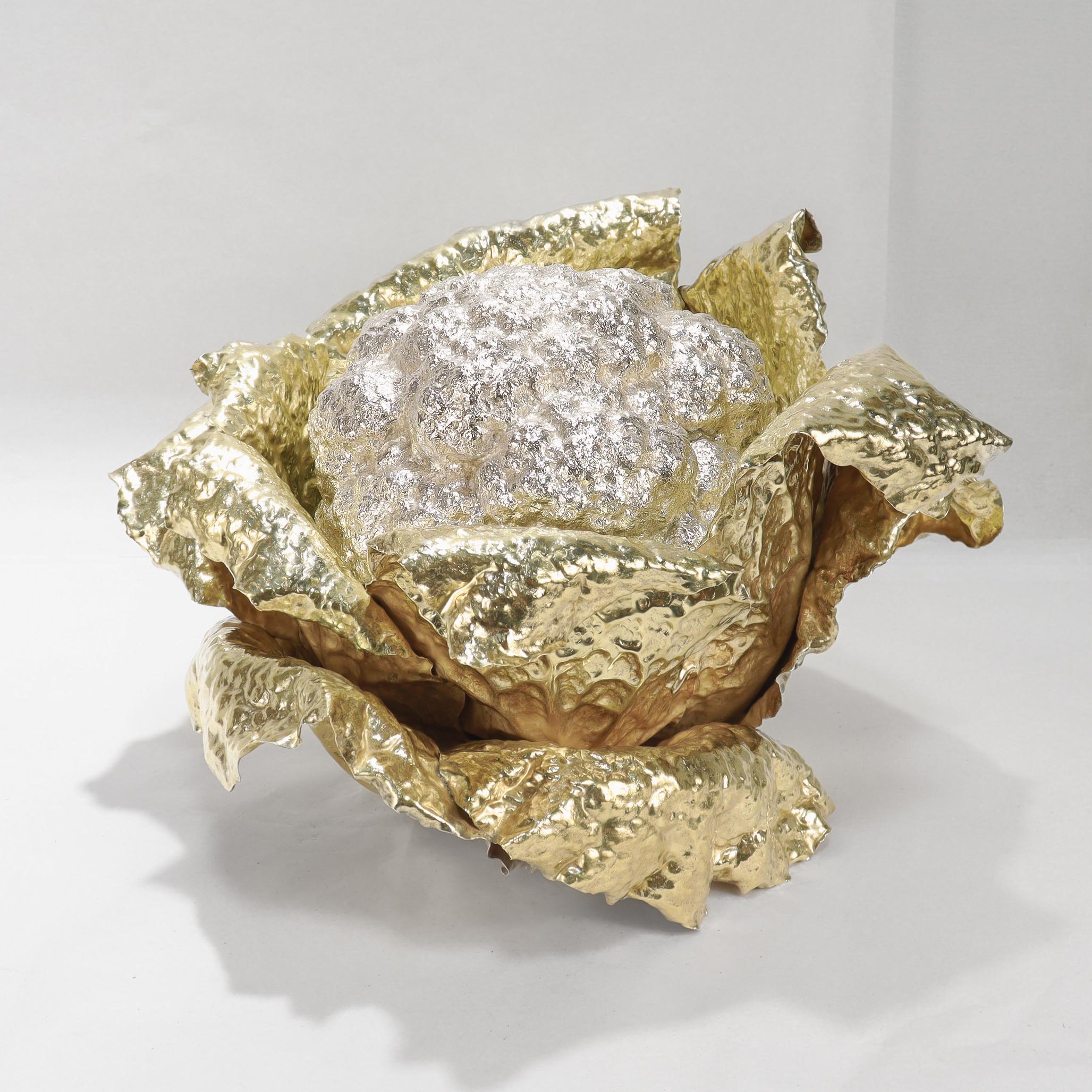 A fine vintage signed Italian centerpiece.

In sterling silver.

By Gianmaria Buccellati. 

From Buccellati's Natura (Nature) collection. 

In the form of over-sized cauliflower with gilt-silver outer leaves and a sterling lid in the form of the