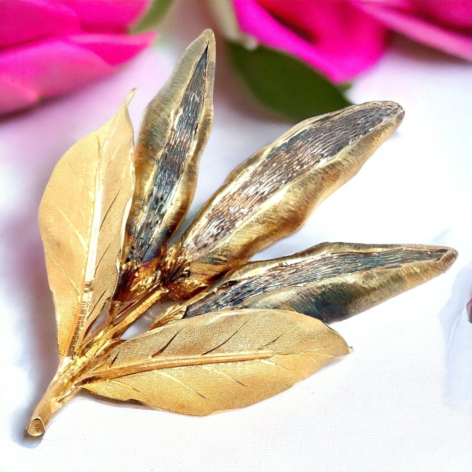 18k Yellow & White Gold Vintage Triple Pea Pods Large Brooch Pin by Buccellati. 
This vintage Buccellati brooch pin is a charming and exquisite piece of jewelry, embodying the brand's renowned craftsmanship. 
Crafted from 18k white and yellow gold,