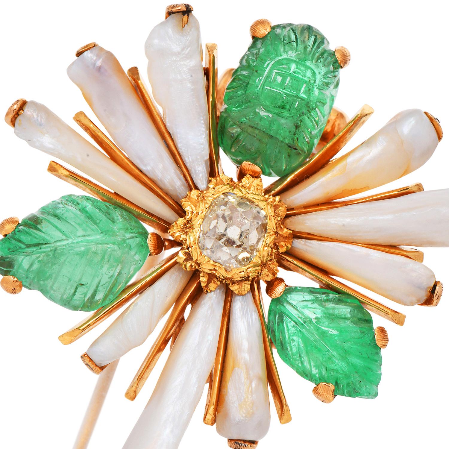 A charming Vintage piece from Buccellati,

Crafted in solid 18K Yellow Gold With its famous Rigato finish.
Centered by a natural fancy yellow old mine diamond weighing close to one carat,  and set with carved emeralds and freshwater pearls as leaves