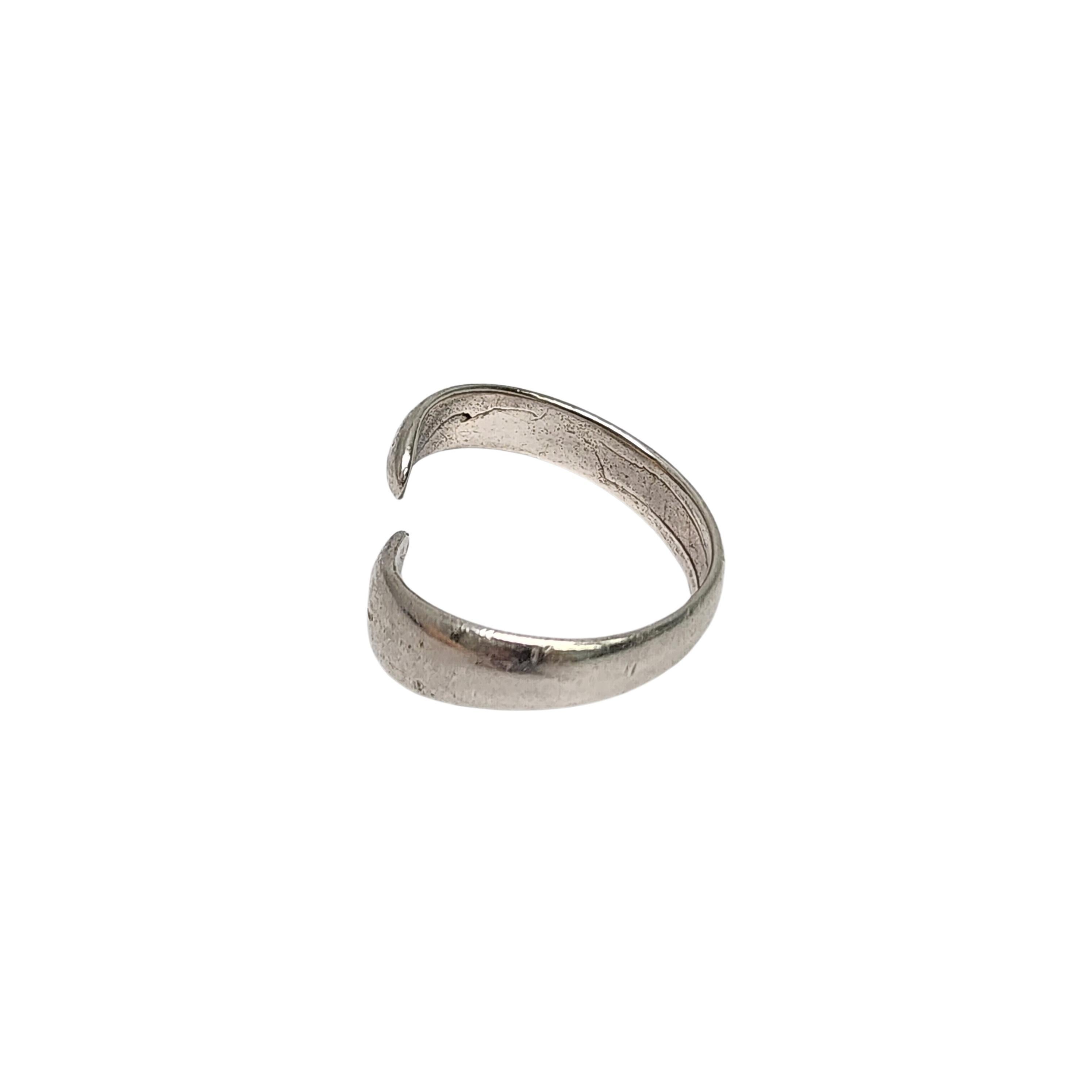 Sterling silver bypass ring by Buch & Deichmann of Denmark.

Size 7 1/2 (may be adjustable because of the bypass design)

This sterling silver ring features a bypass design by Danish designer B&D (Buch & Deichmann), 1969-85.

Weighs approx 3.7g,