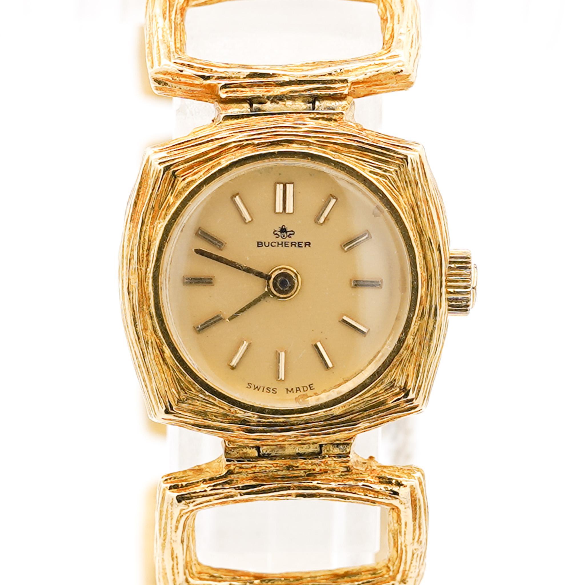 18K Yellow Gold Bucherer Signed Swiss Made Textured Bracelet Ladies Wristwatch, Caseback No. #36056.

A ladies' cocktail wristwatch by Bucherer, showcasing a striking Brutalist design. The bracelet features textured gold loop links, complementing a
