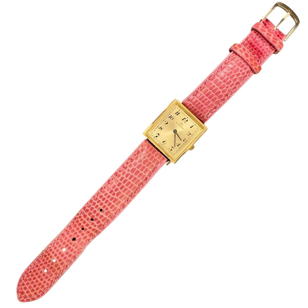 Vintage Bucherer 24mm 18k Gold Women’s Wrist Watch. Stunning vintage watch made in 18k solid gold 25.5mm with crown. The watch is Swiss made and operated by a battery. The watch is vintage and rare and features an aftermarket pink lizard trap that