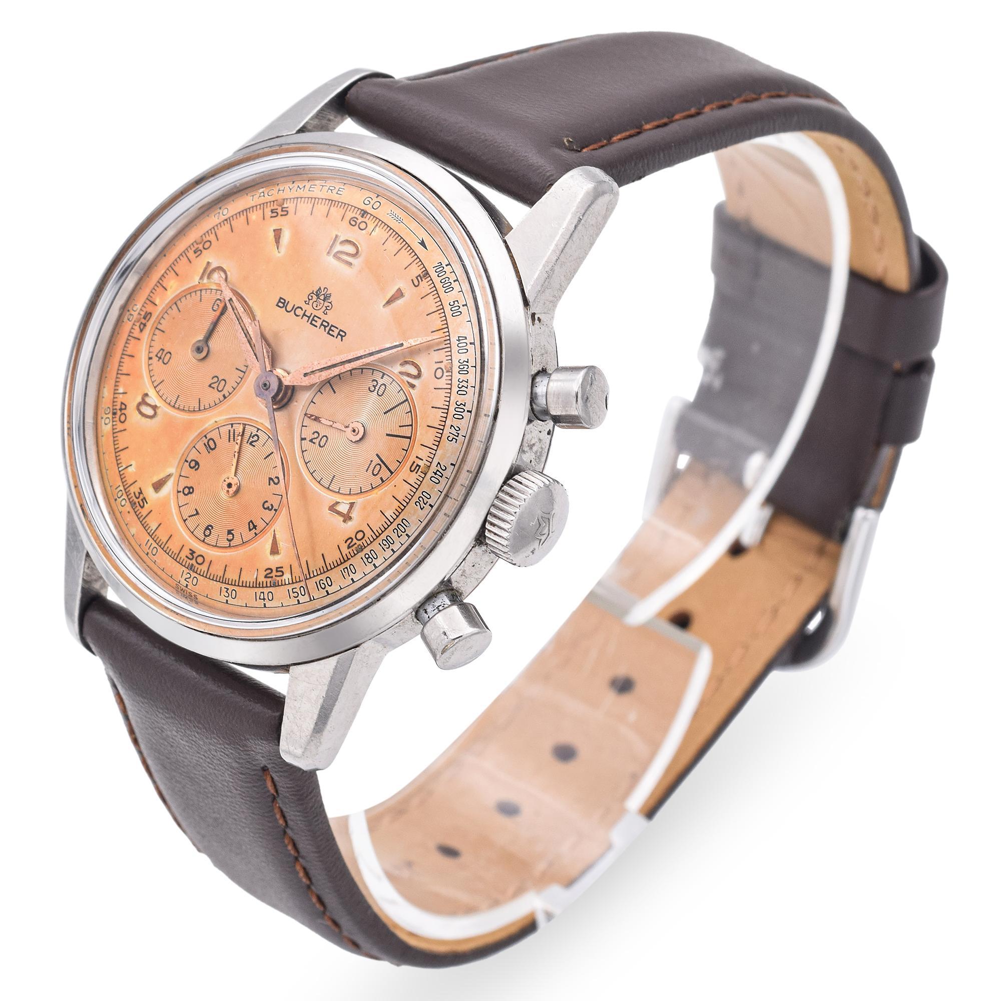 This vintage Bucherer stainless steel chronograph hand-wind men's watch is a standout piece that blends mid-century Swiss craftsmanship with bold, functional design. Encased in durable stainless steel, it features a classic chronograph layout with