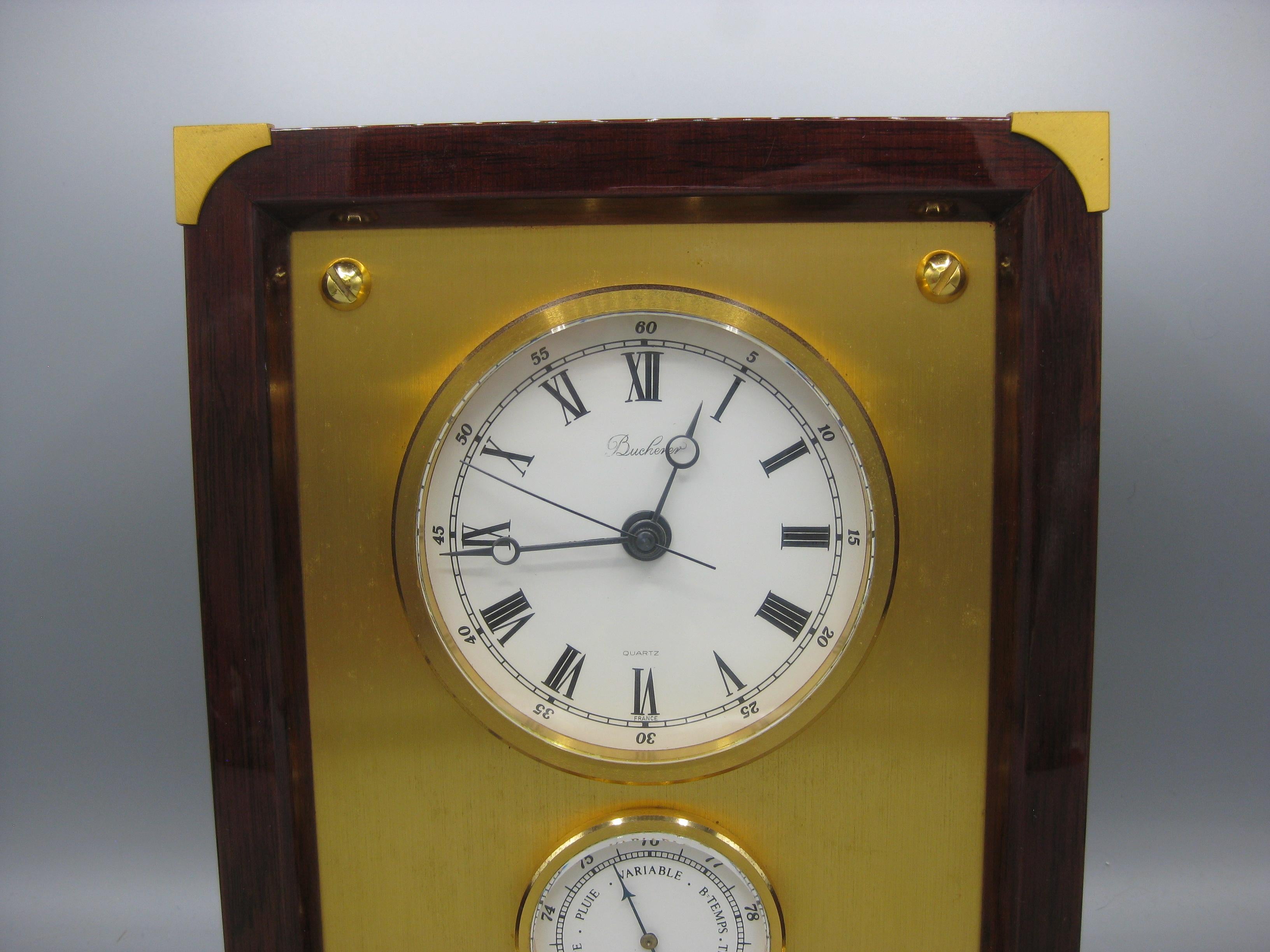 Splendido ed elegante orologio da tavolo/mantello Bucherer di alta gamma con barometro. Prodotto in Francia e risalente agli anni '70. Un design e una forma meravigliosi. Il legno ha un colore rosso e sembra essere una specie di palissandro. Gli