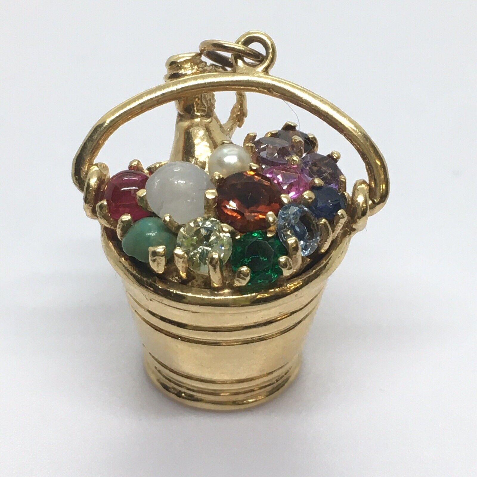 Vintage Bucket Of Champagne Charm 14K Gold Circa 1960s American Gem set Ruby

Weighting 12.3 gram
Hanging 1.25 inch 
Bucket 1/2 inch on bottom 3/4 inch on top
Marked 