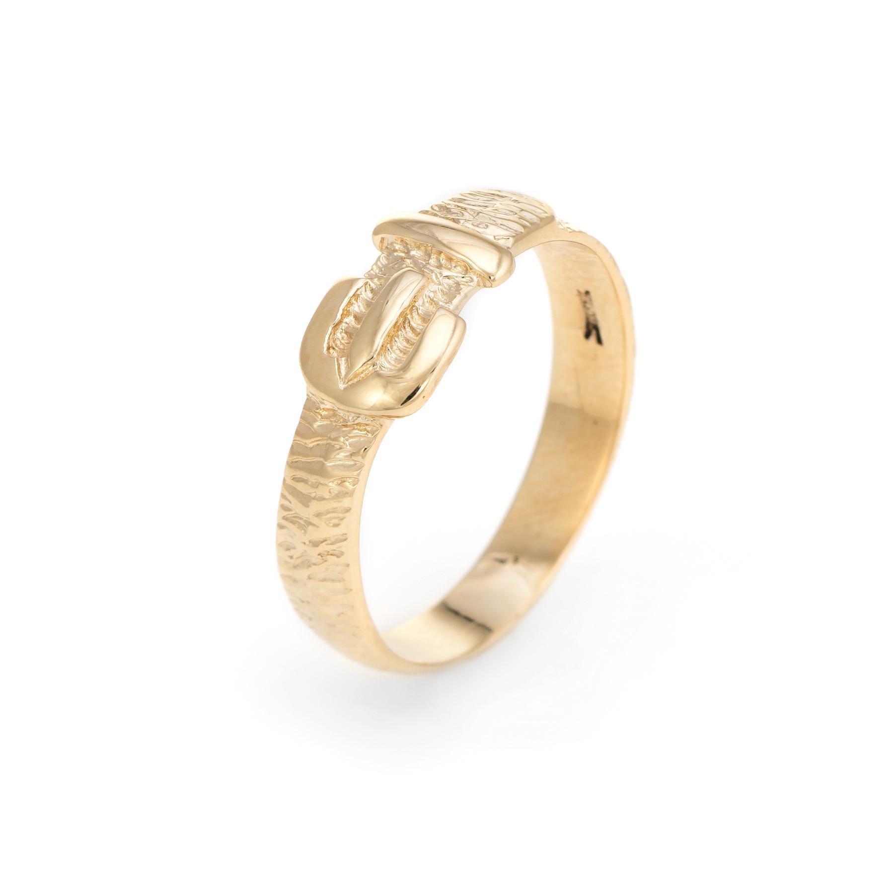 Finely detailed vintage buckle band, crafted in 9 karat yellow gold. 

The buckle design has long been popular as a promise ring or love token. The clasped belt wraps around the finger, representing your devotion to the one you love. The ring would
