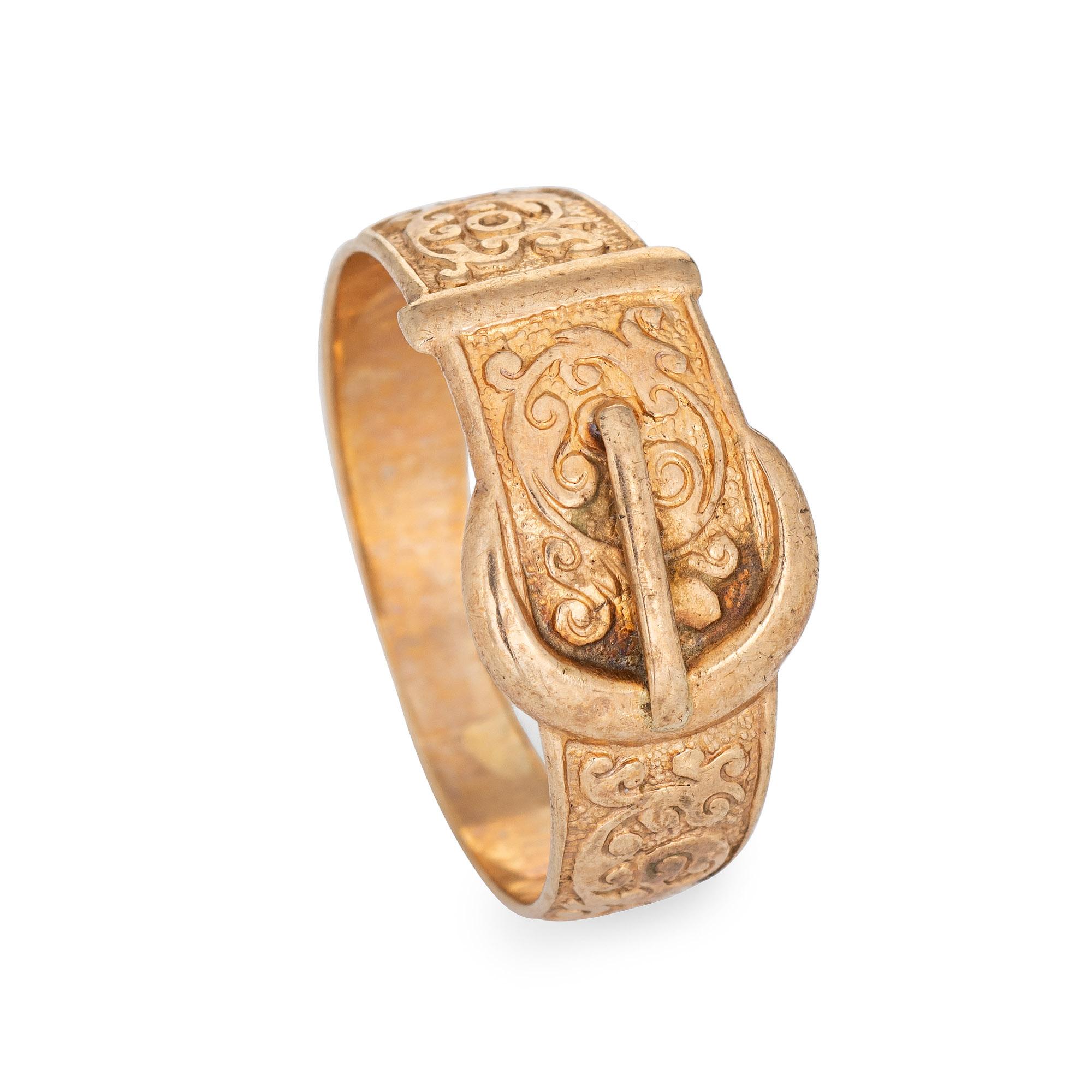 Stylish vintage buckle ring crafted in 9 karat yellow gold. 

The stylish buckle ring features a charming scrolled design. Currently a size 10 1/2 (can be resized) the ring is great worn alone or stacked with your fine jewelry from any era. The