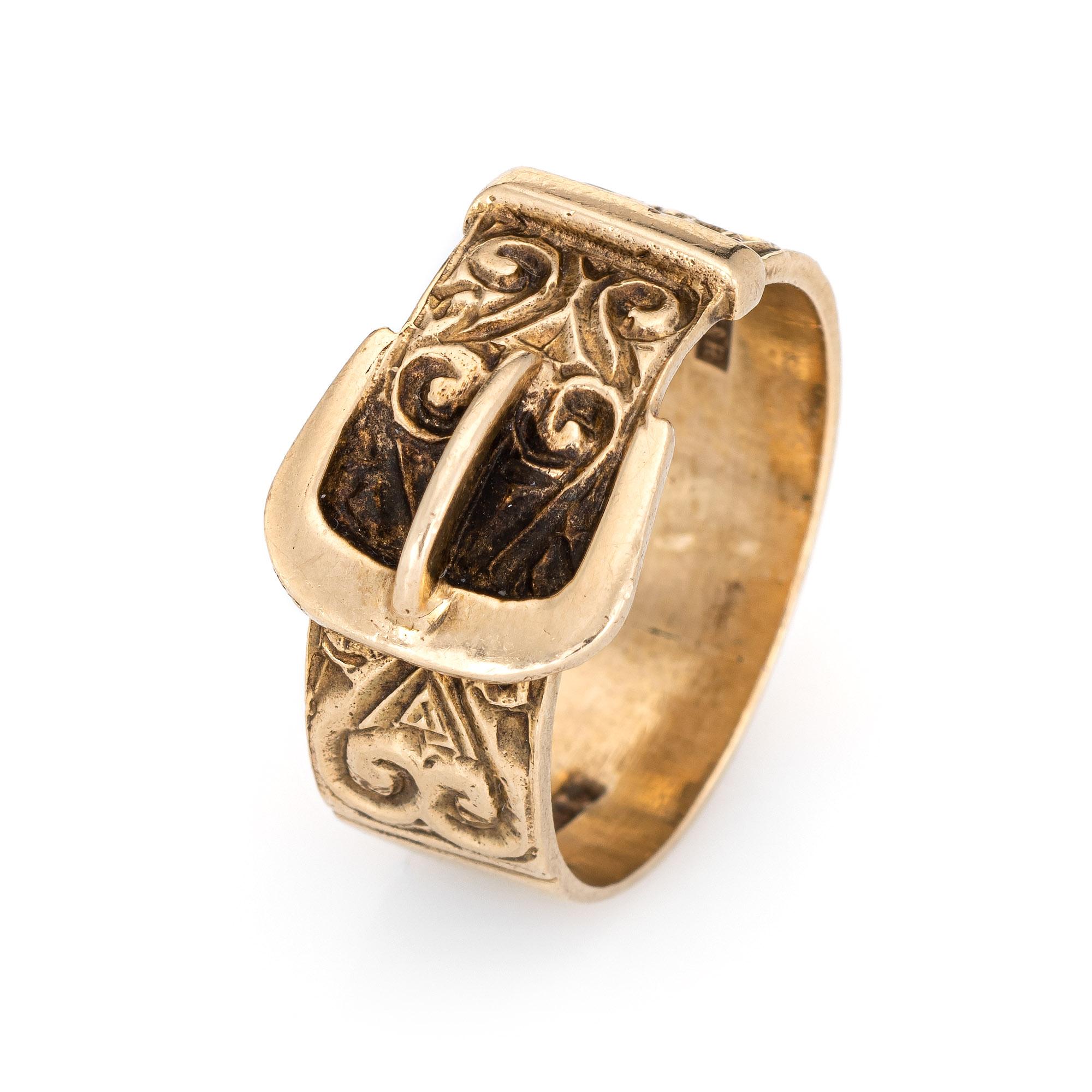 Stylish vintage buckle ring (circa 1970) crafted in 9 karat rose gold. 

The buckle ring features etched scrolled detail with a romantic heart shaped motif to one end. The buckle ring is a popular design, representing the joining of two lives